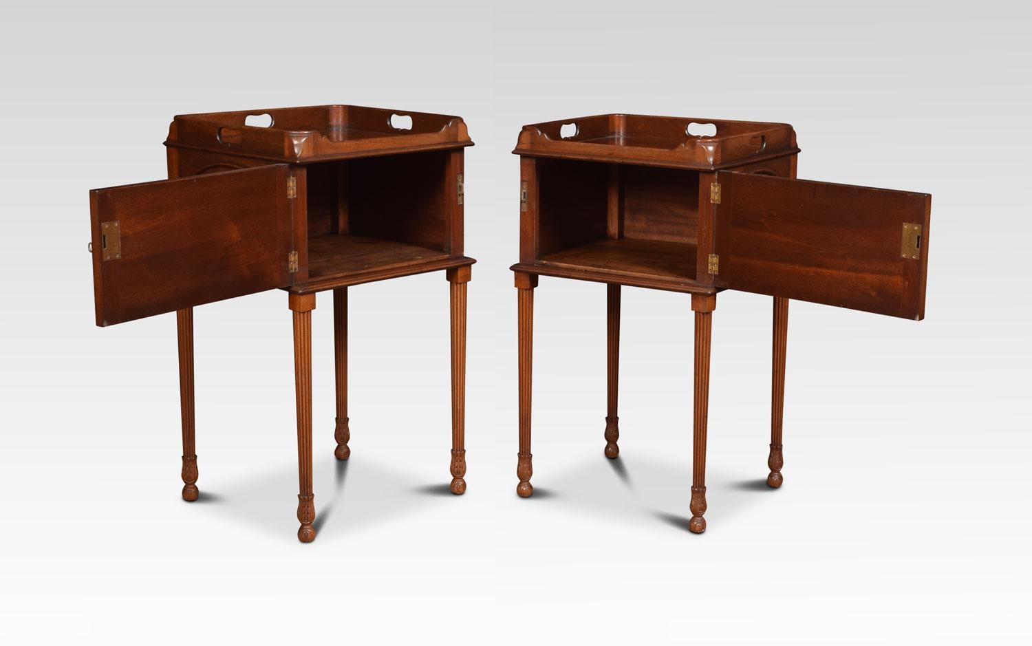 Pair of mahogany bedside cupboards each with tray tops, above oval moulded flame mahogany doors. All raised up on reeded fluted legs.
Dimensions:
Height 31.5 inches
Width 18.5 inches
Depth 16.5 inches.