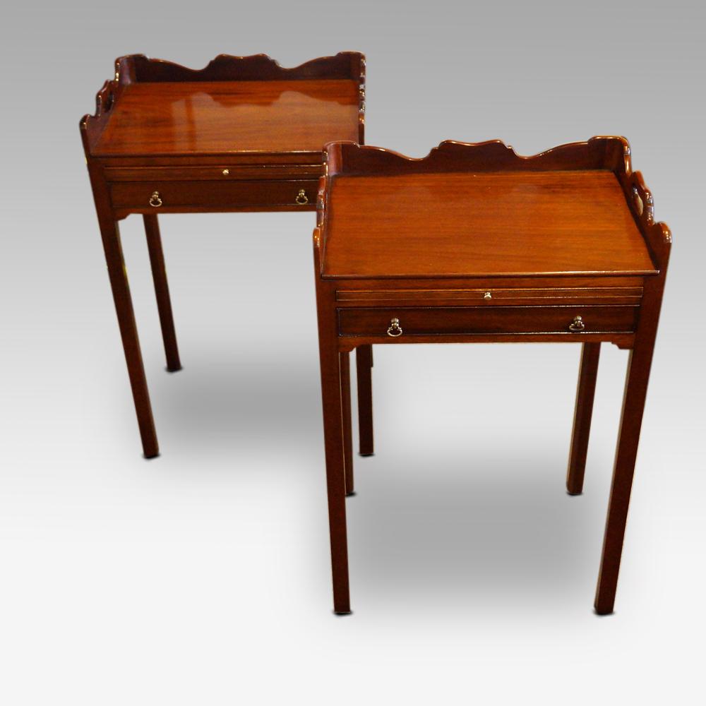 Pair of mahogany bedside tables
This pair of mahogany bedside tables were made in the first half of the 20th century.
Each table is fitted a full width drawer and a pull-out slide to place drinks or to give more surface when required. The top has