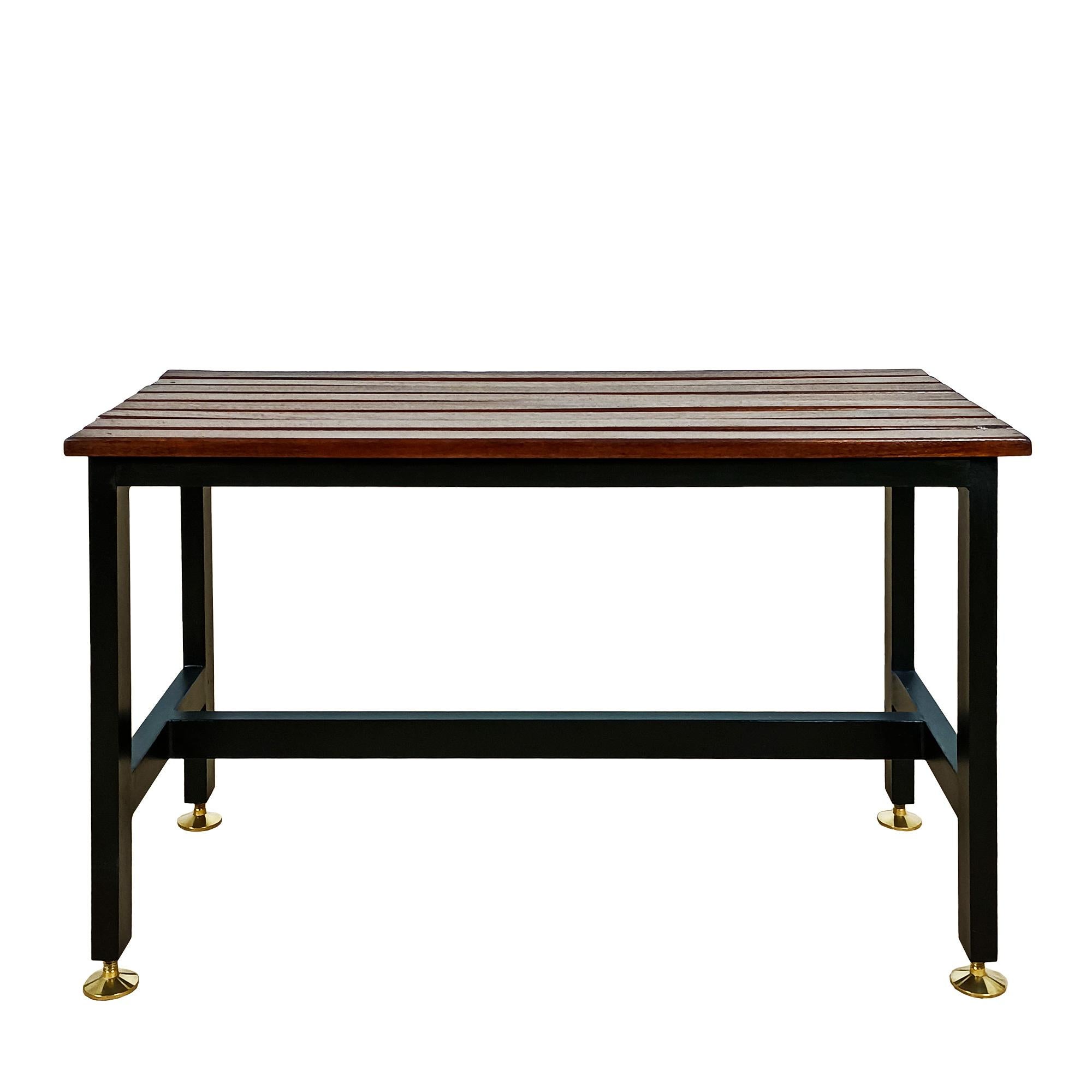 Pair of varnished benches, solid mahogany with blackened steel structure and polished brass adjustable feet.

Italy circa 1950.