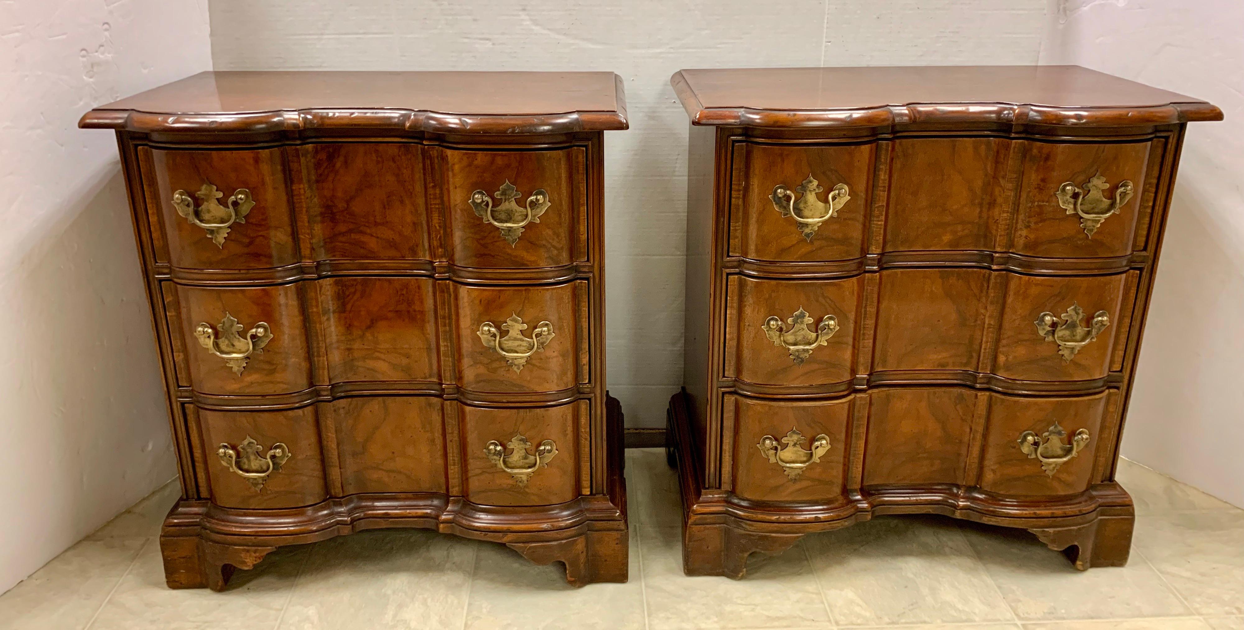 Pair of small mahogany three-drawer block front chests with dovetailed drawers, bracket feet and brass hardware. They have a beautiful aged patina. They’re small size make them perfect as nightstands.