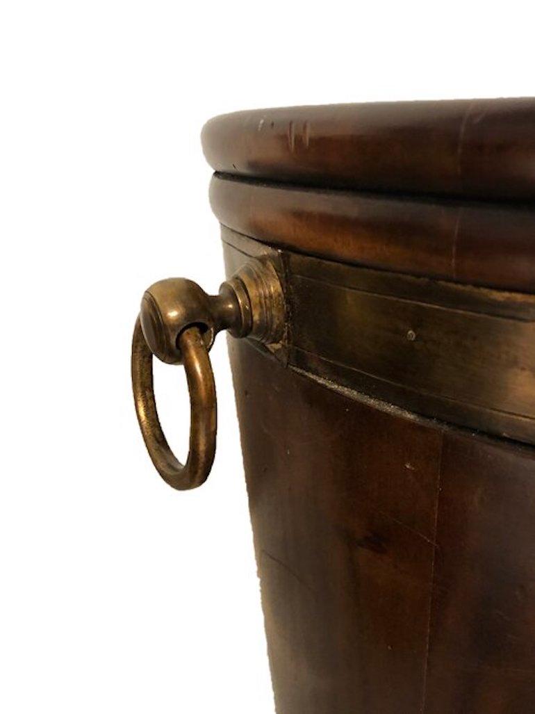 A fine rare Irish pair of fine mahogany brass bound Georgian peat buckets.

1780 in immaculate condition.