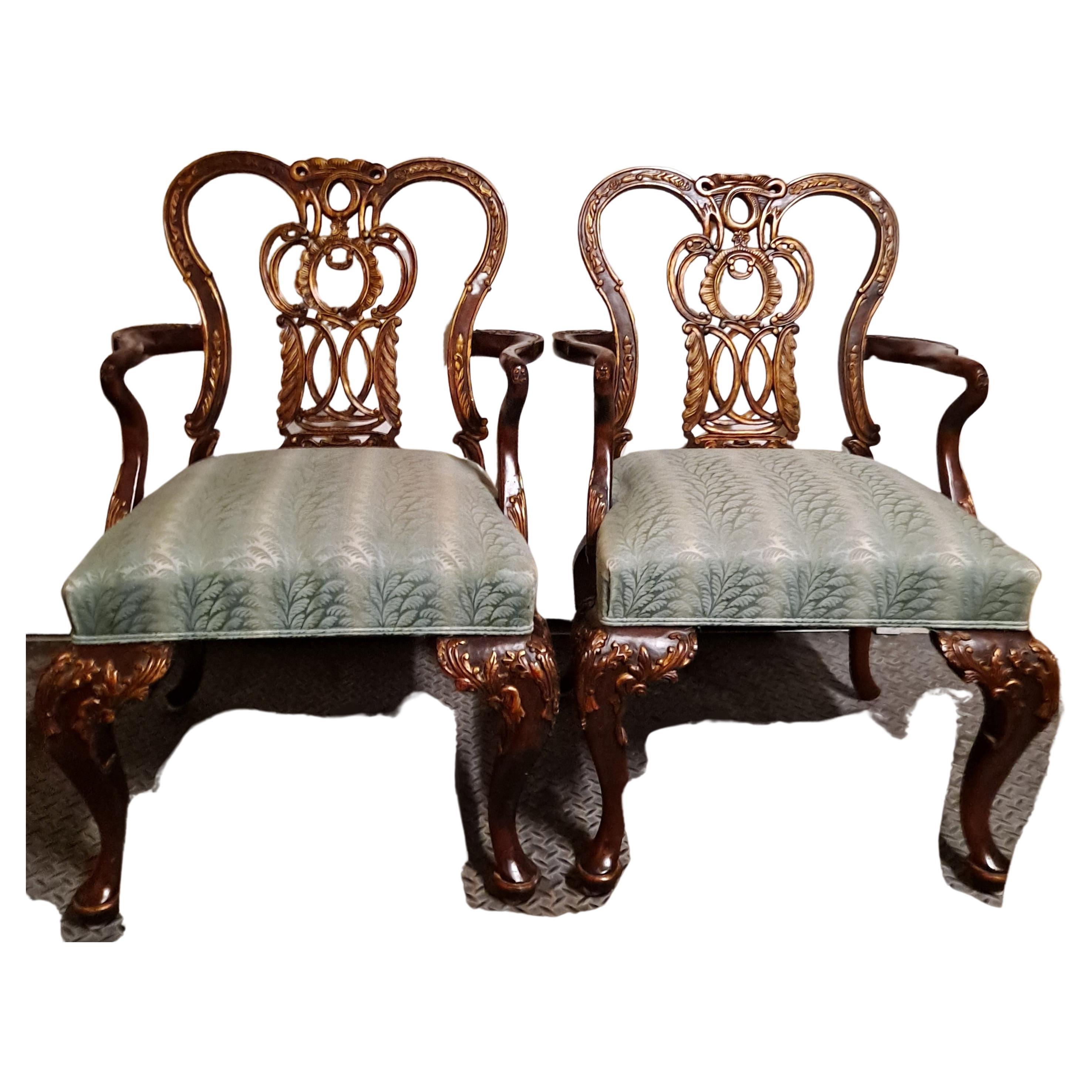 Pair of mahogany century armchair Chippendale revival. Striped upholstery with gooseneck arms carving

26 x 22 x 37