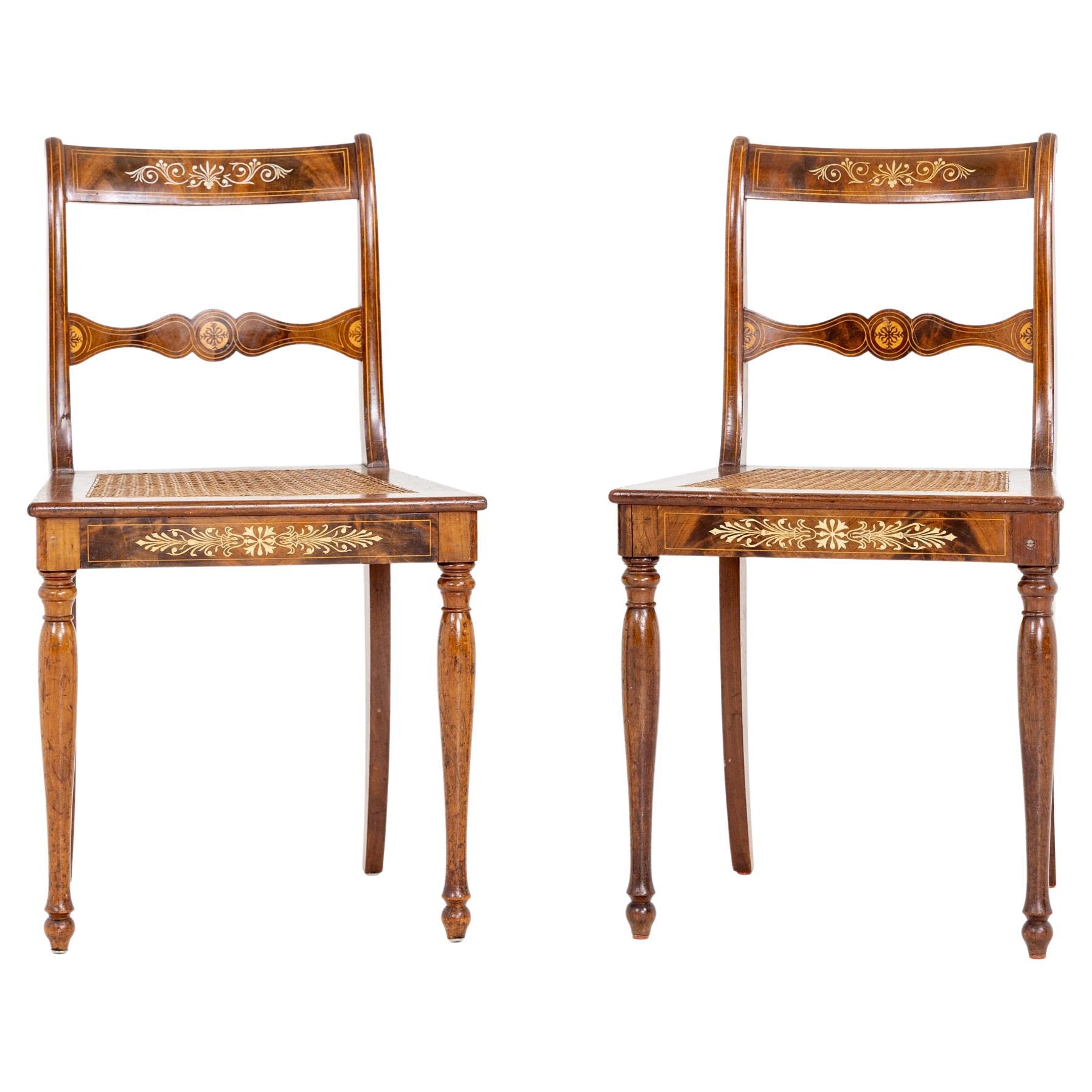 Pair of chairs in mahogany with paste inlays and wickerwork, Germany, Berlin, c. 1825/30. Cf. 1987 Orangerie catalog, catalog no. 88, Antike Welt 1996/6, p. 484, fig. 16; S. Hinz, Innenraum und Möbel, Berlin 1980, fig. 578.