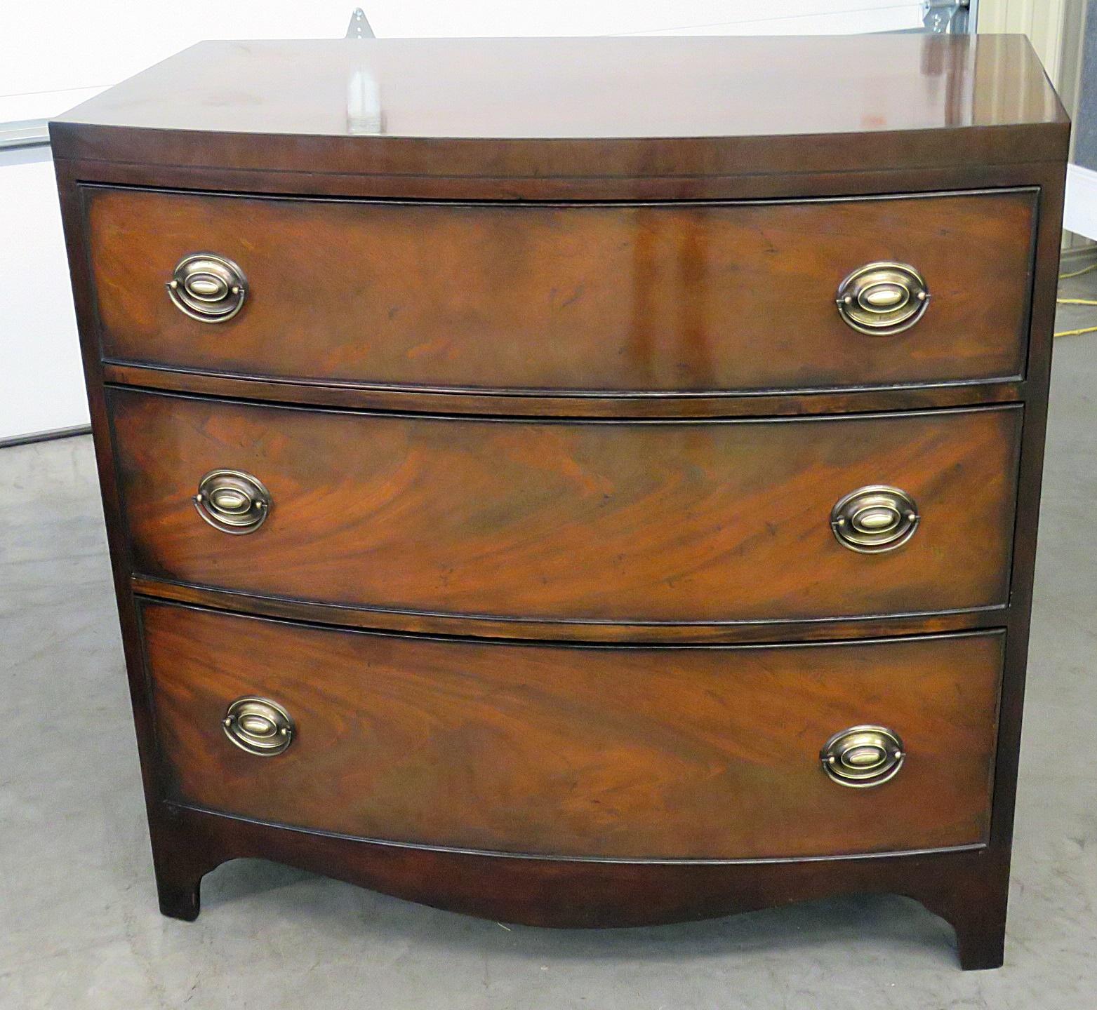 Pair of mahogany three-drawer commodes by Sahon.