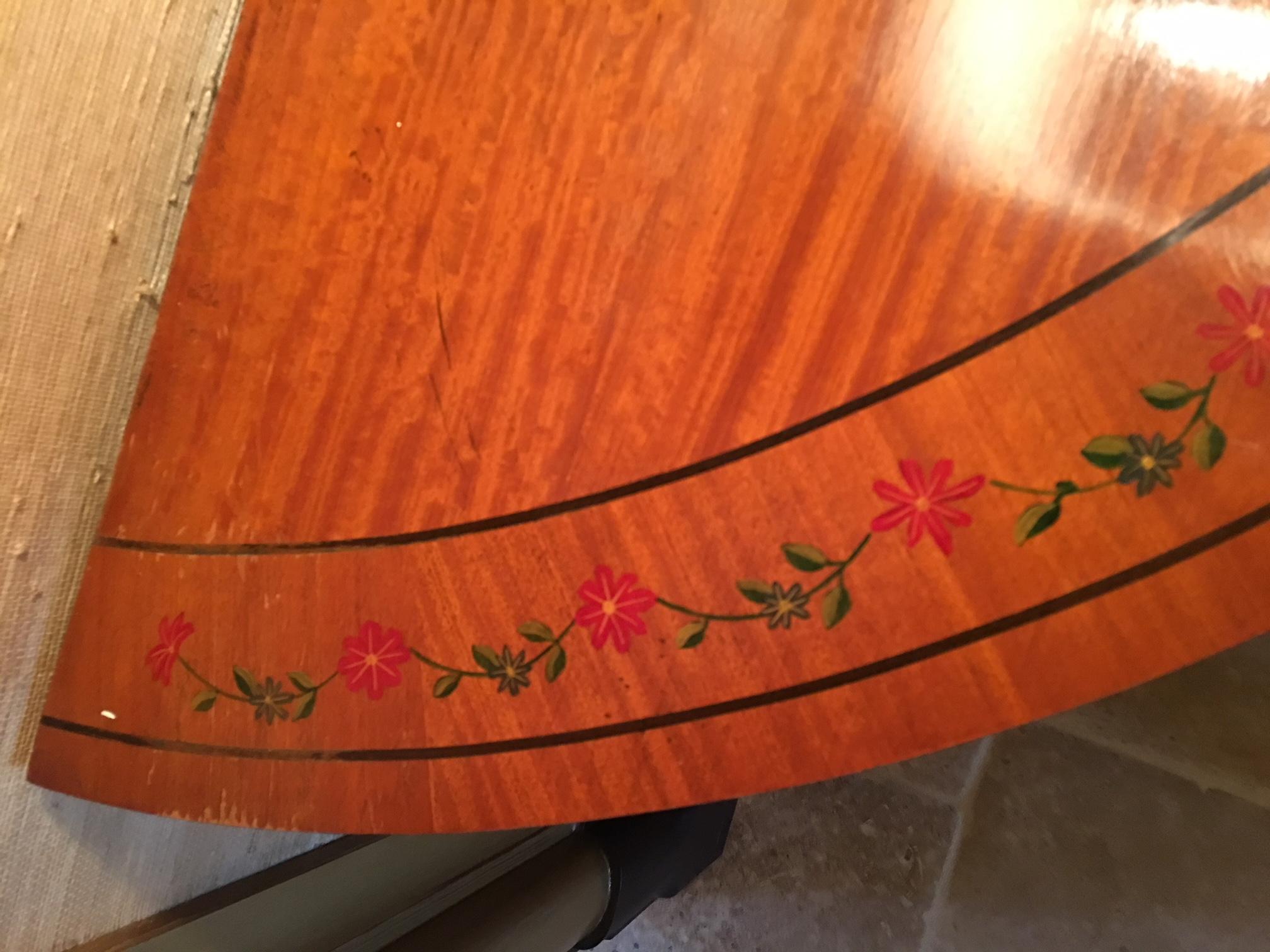 20th century pair of mahogany demilune tables with hand painted leaves and flowers on apron and legs.
 