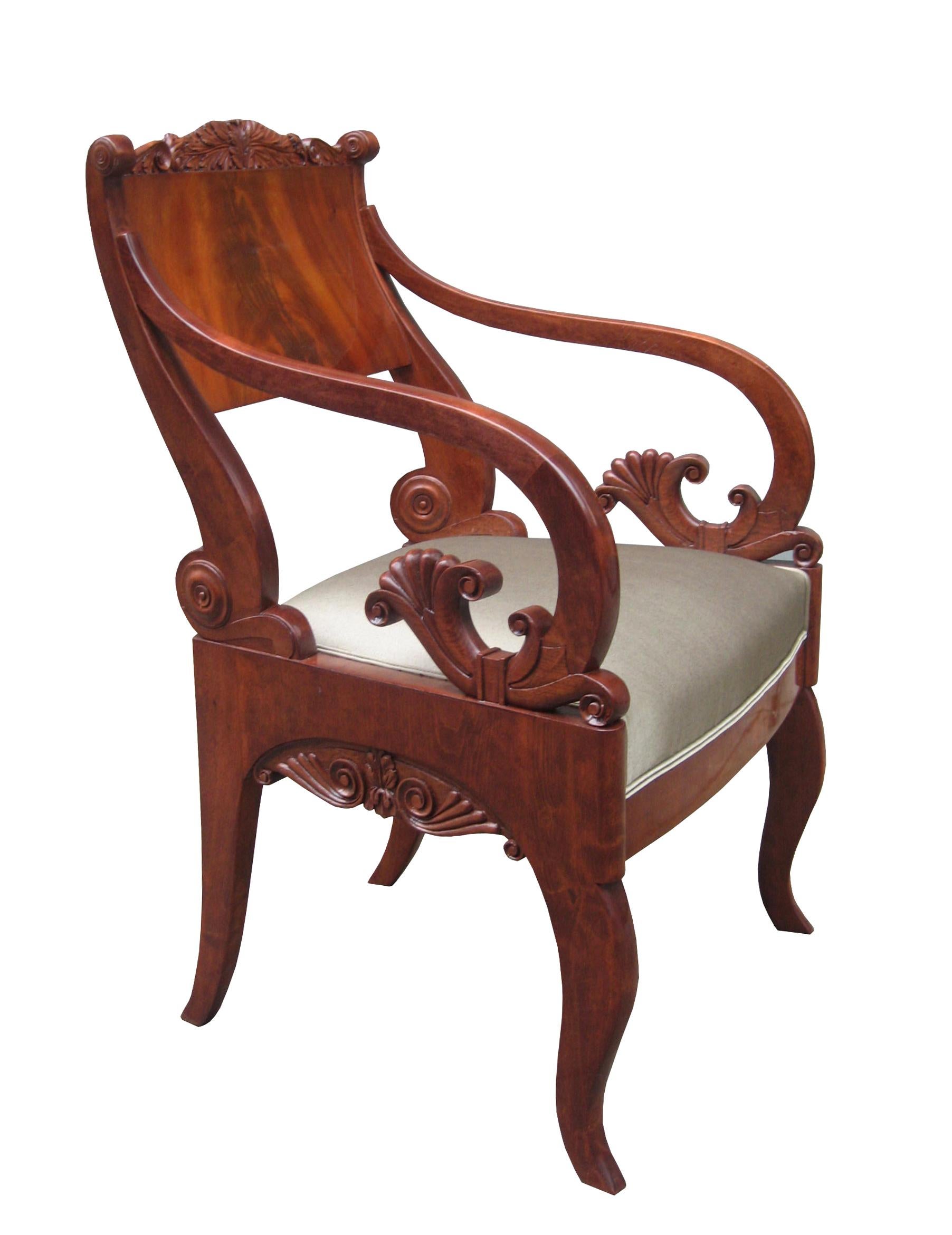 A fine pair of Empire armchairs.
Solid mahogany with fine carved details throughout.