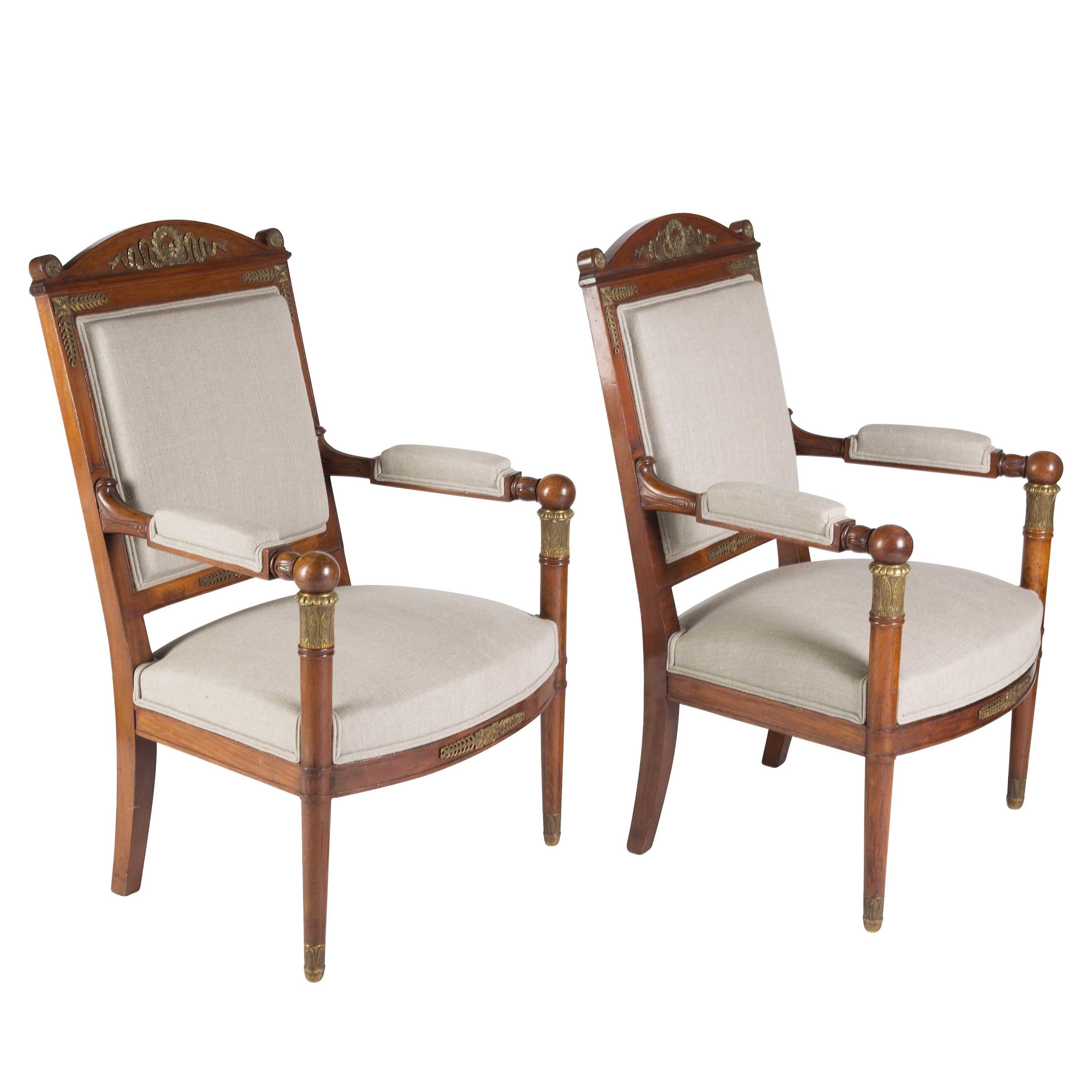 A pair of Empire Revival mahogany fauteuils with bronze mounts, fully reupholstered, French, circa 1875. Measures: Seat height 43 cm, seat depth 46 cm.
