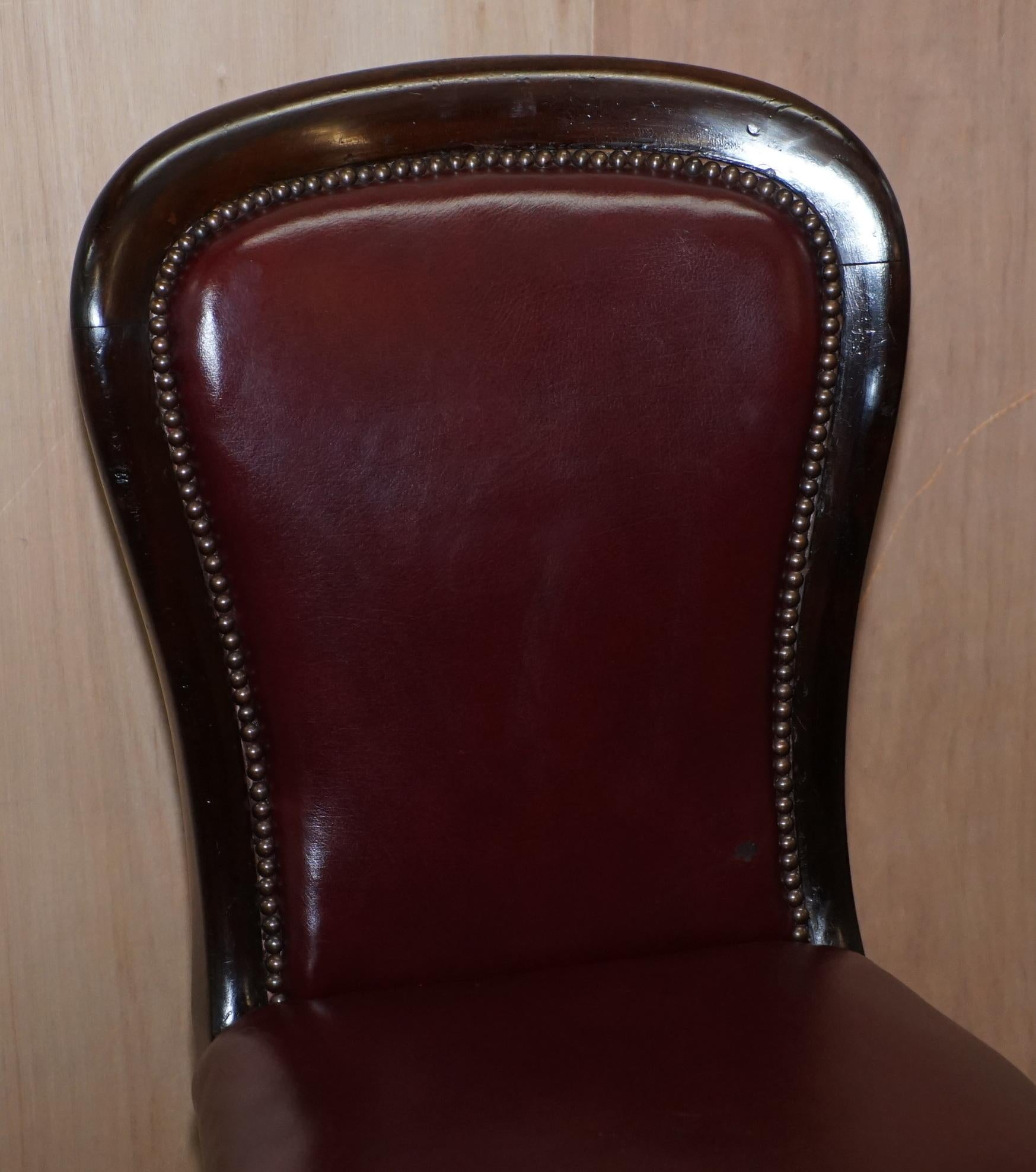 Mid-19th Century Pair of Mahogany Framed Oxblood Leather Medallion Back Side Occasional Chairs