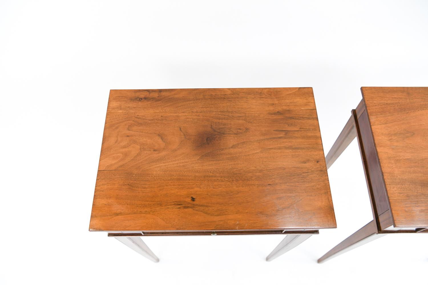 This pair of mahogany nightstands by Frits Henningsen sits on the line between traditional and modern Danish design. This transitional period, circa 1940s, is embodied by the iconic designer Frits Henningsen. These side tables or nightstands have