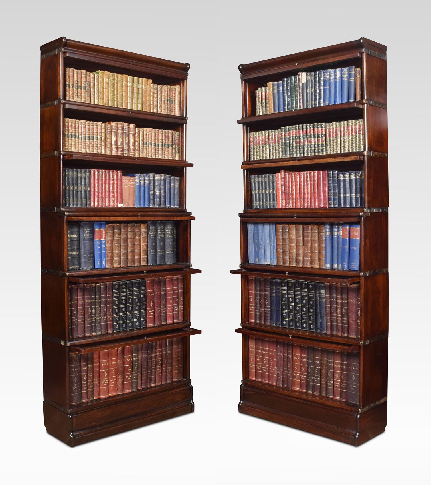 Pair of mahogany bookcases, the moulded top above six-section fitted with glazed doors. All raised up on plinth base.
Dimensions
Height 84.5 inches
Length 34 inches
width 12.5 inches.