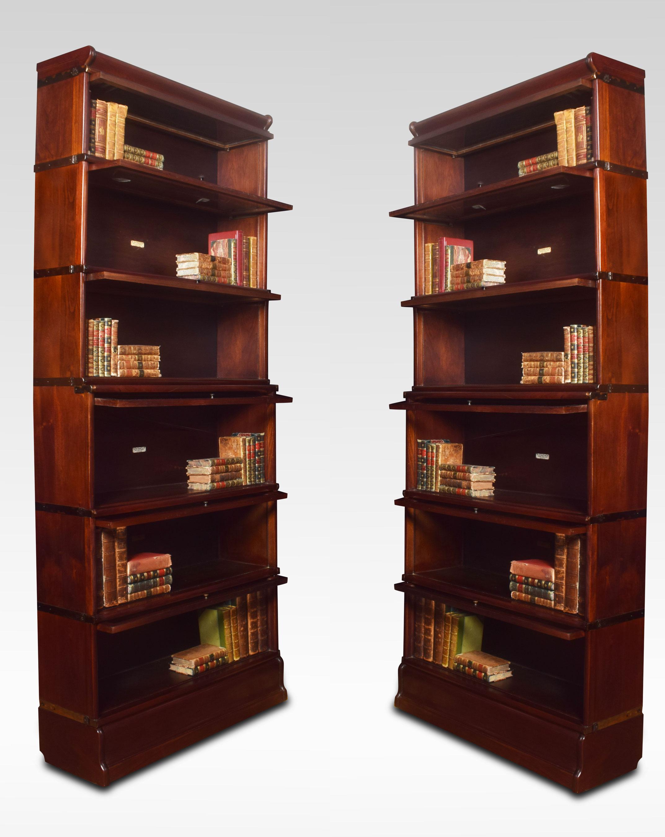 Pair of mahogany globe Wernicke six-section bookcases, the moulded top above six graduated sections all having glazed doors, raised up on plinth base.
Dimensions:
Height 86 inches
Width 34 inches
Depth 13 inches.