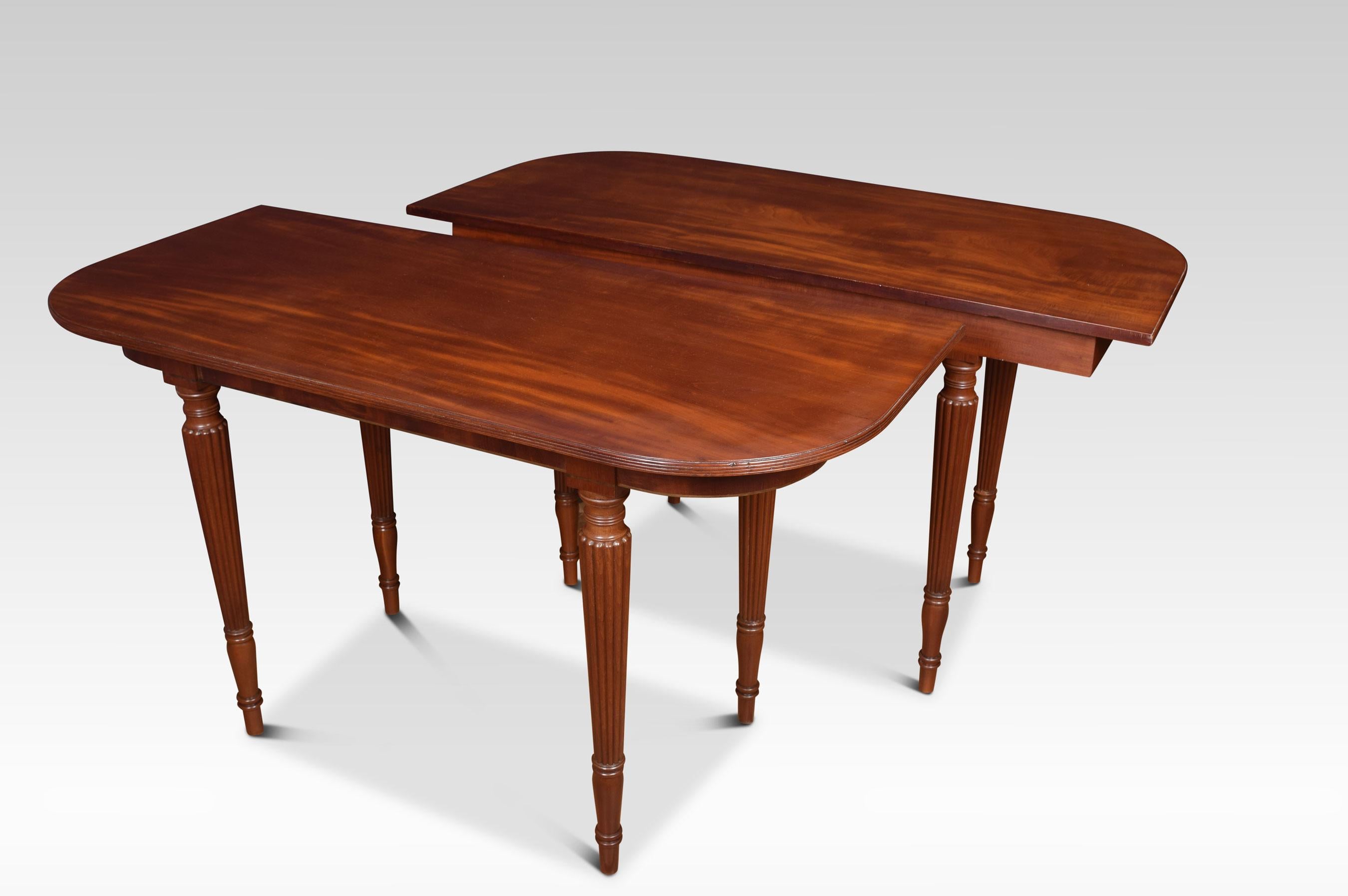 Pair of mahogany hall tables the rectangular top with rounded corners. above moulded freeze with ebony inlays. Raised up on turned and reeded tapering legs.
Dimensions:
Height 33 inches
Width 55 inches
Depth 25 inches.