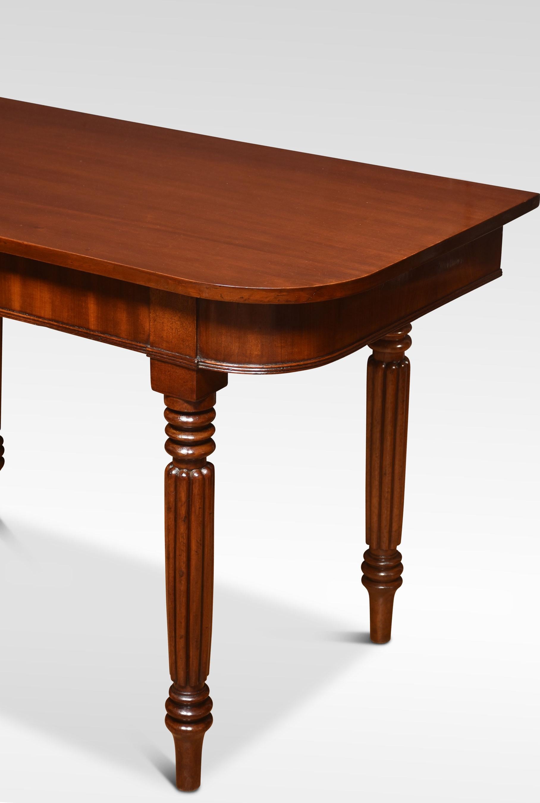 Pair of mahogany hall tables the rectangular top with rounded corners, above moulded freeze. Raised up on turned and reeded tapering legs.
Dimensions
Height 30 Inches
Width 49 Inches
Depth 24.5 Inches.