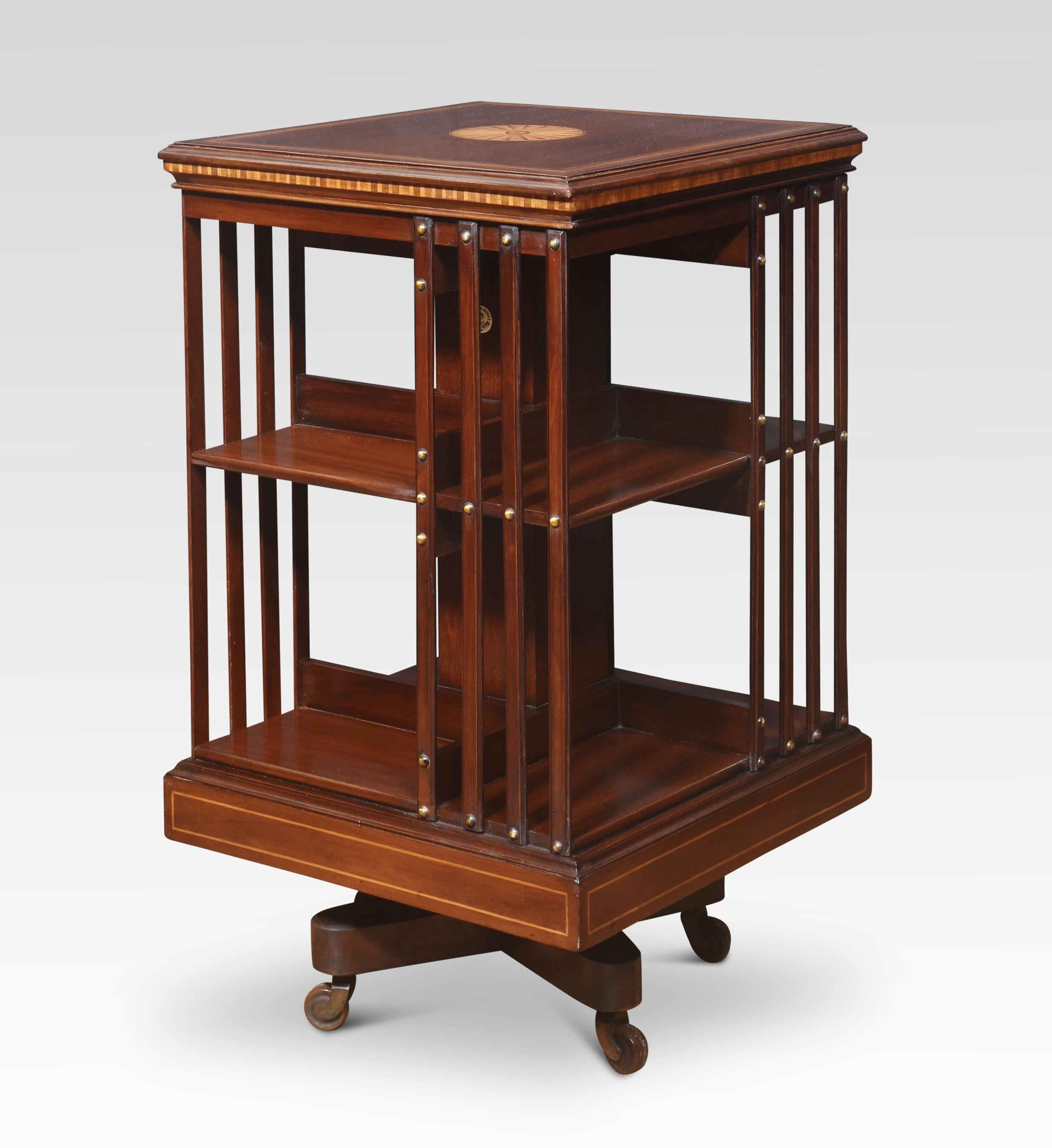 Pair of Maple & Co revolving bookcases. The well-figured mahogany and satinwood banded tops with central fan inlay, above an arrangement of shelves raised up on a cruciform base with castors.
Dimensions
Height 34.5 Inches
Width 20 Inches
Depth 20