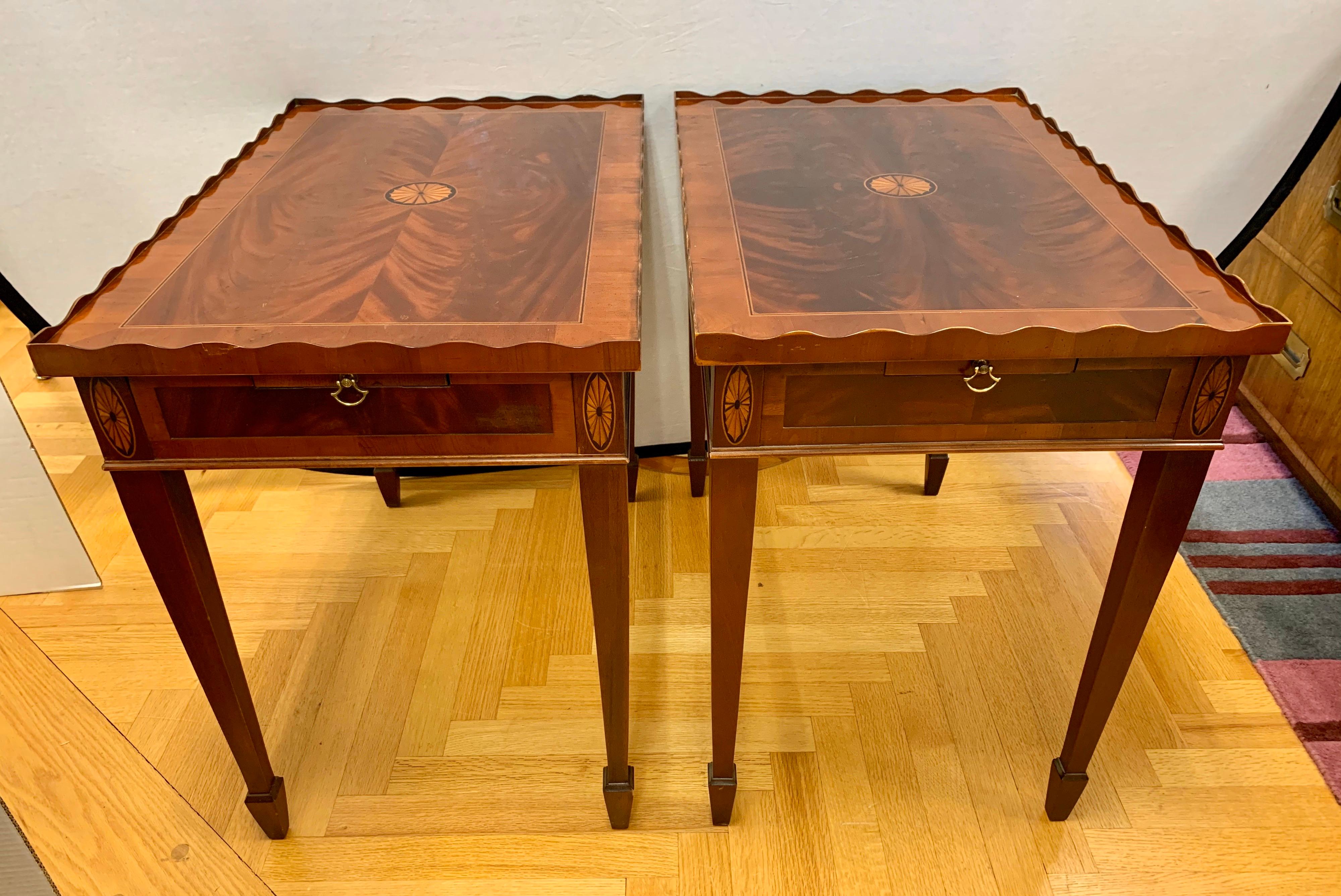 Elegant pair of matching mahogany inlay occasional tables with tapered legs, rimmed top and magnificent inlay. Designed and manufactured by Hekman Furniture, in the USA. They are showstoppers.