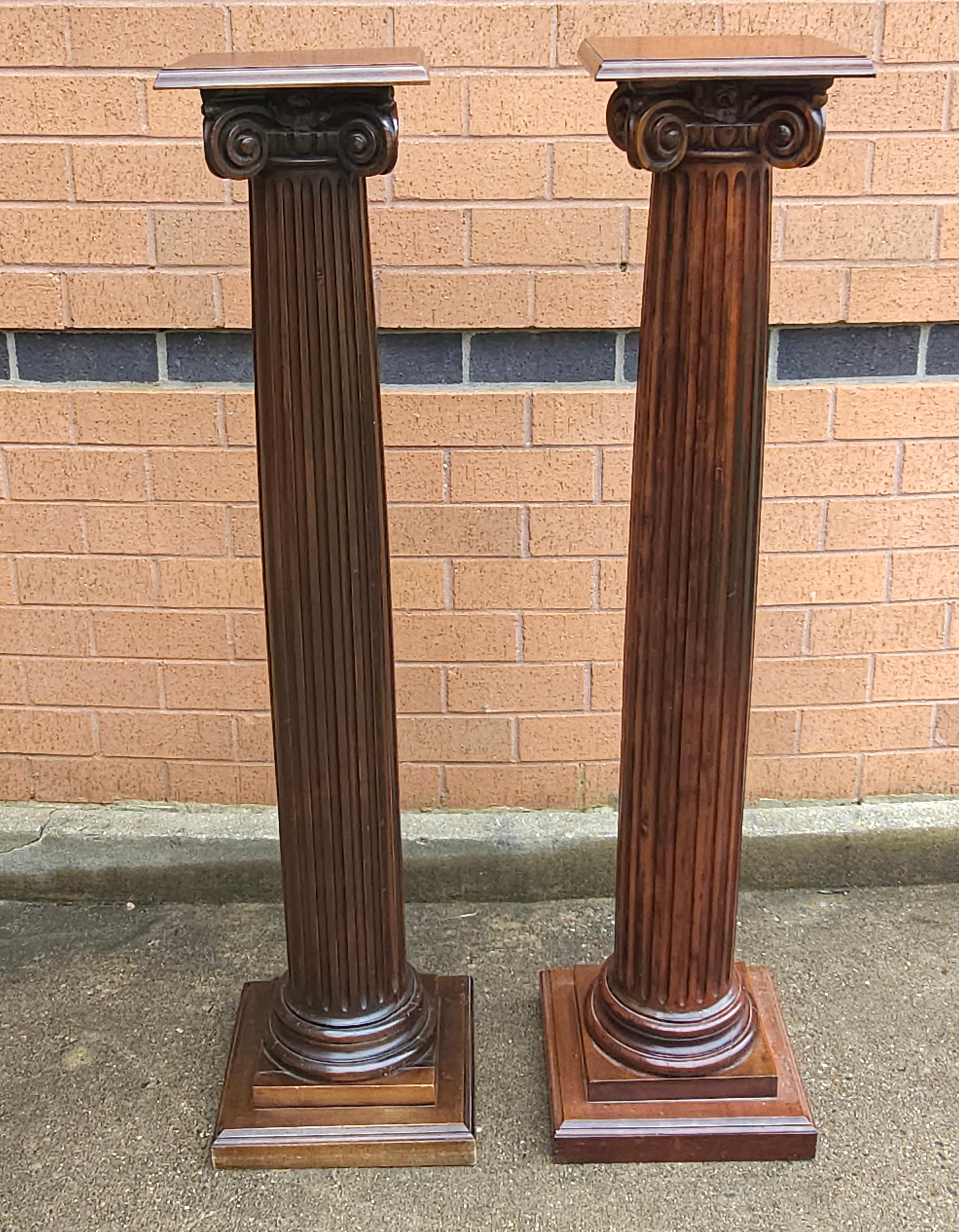 An Early 20th Century Pair Of Mahogany Architectural Ionic Order Style Column-Form Pedestals standing 47