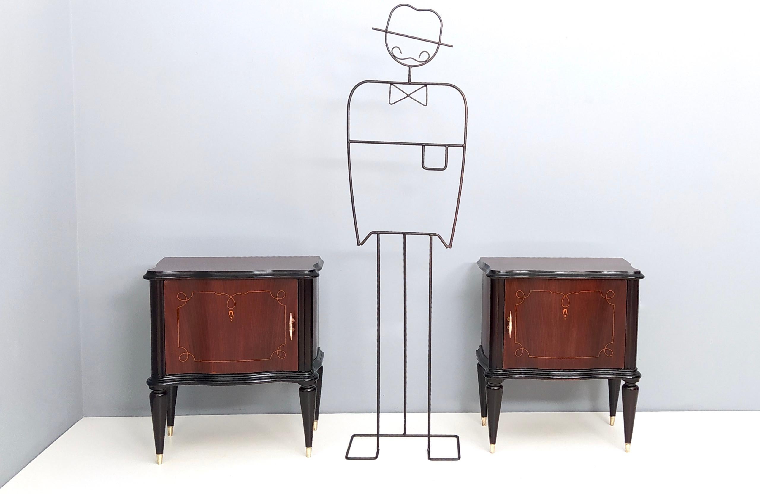 Made in Italy, 1950s.
They are made in walnut and feature inlaid, durmast interiors and brass handles and feet caps.
These nightstands may show slight traces of use since they're vintage, but they have been perfectly restored, therefore they can be