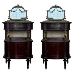 Pair of Mahogany nightstands with mirror crest and bronze mounts