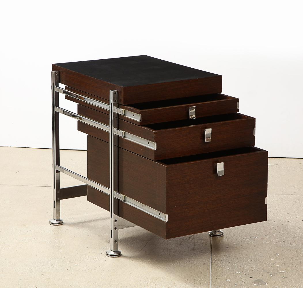 Mahogany, black laminate, chrome-plated steel. 3-drawer chests mounted into steel structures with custom steel drawer pulls. A truly iconic Belgian design. *2nd matching pair available.