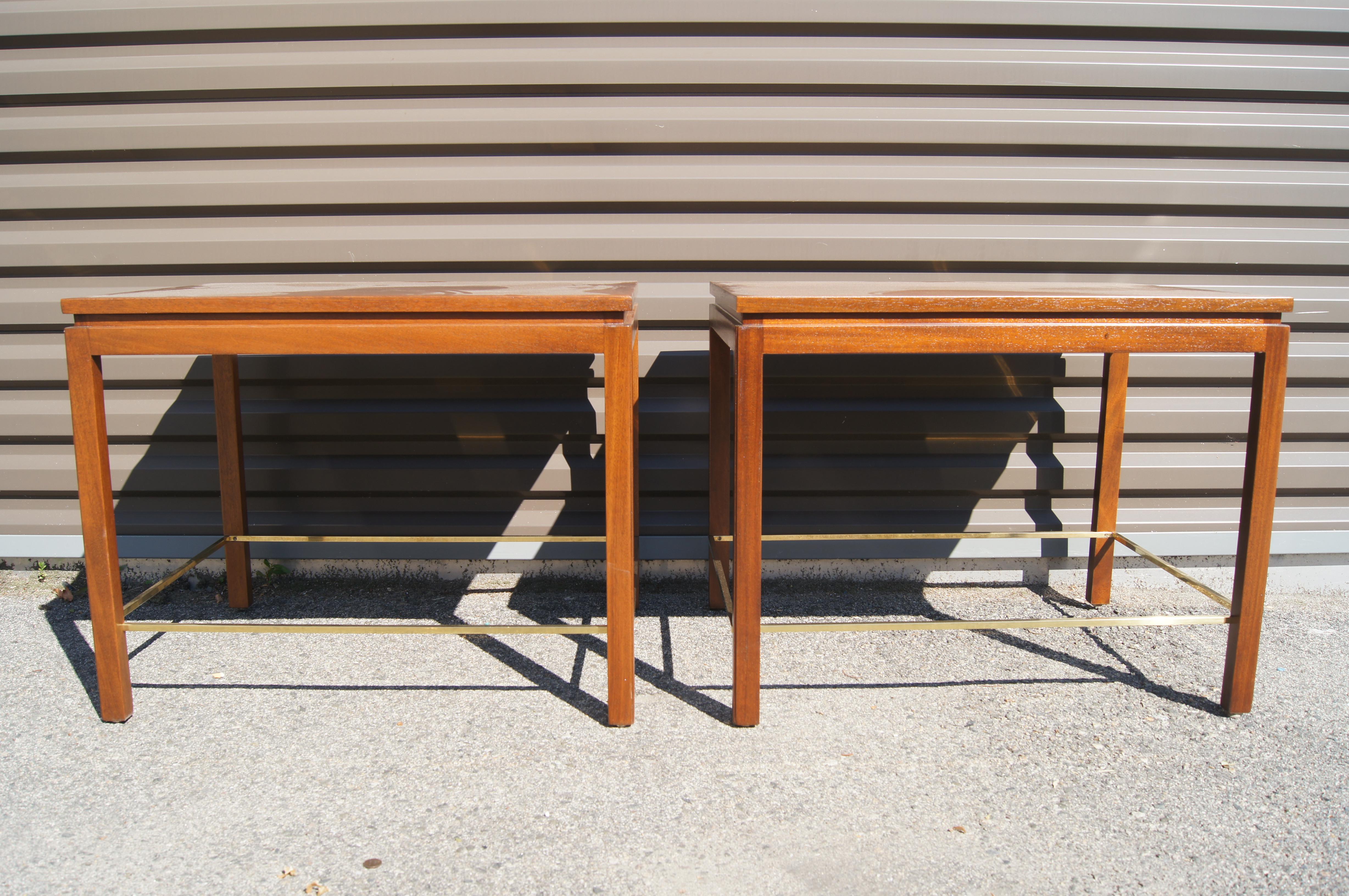 Edward Wormley designed these elegant side tables for Dunbar. This pair features a solid mahogany frame with a recessed edge and an inset walnut top. Slender brass stretchers add strength and reinforce the tables' clean lines.

The brass Dunbar