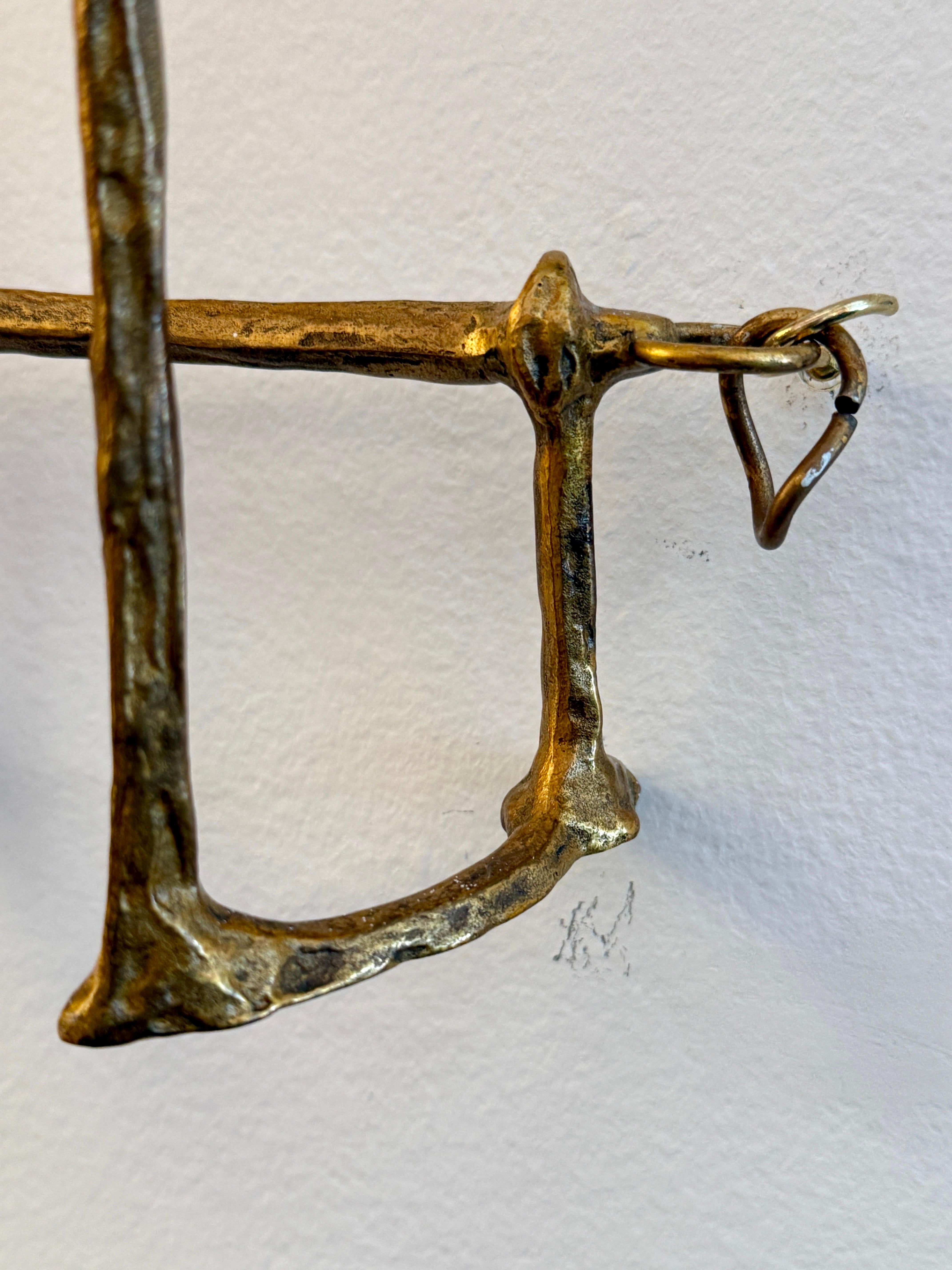 Pair of Mail Coach sconces designed in 1962 by Félix Agostini (1910-1980), Paris France.  Bronze with gilded patina, and original silk lampshades, some minor spotting. Lamp sockets have been rewired - one light bulb each.

DIMENSIONS:
Total height: