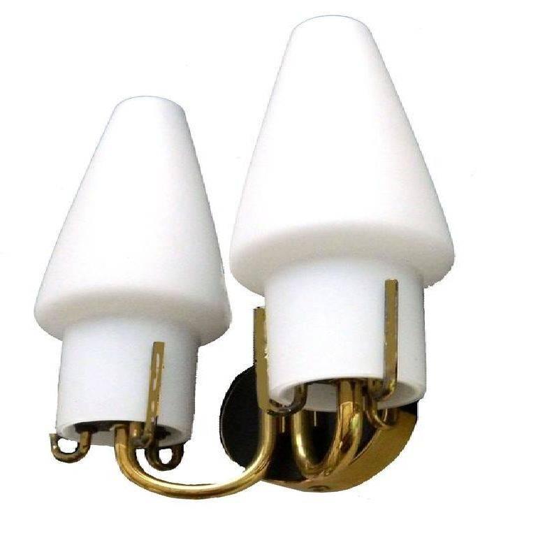 Pair of Arlus sconces, 2 lights per sconce, original conic opaline shades. US rewired and in working condition. 45 watts max bulb. Back plates dimensions: 2, 7/8 diameter.Have a look on our the largest collection of French and Italian Mid-Century