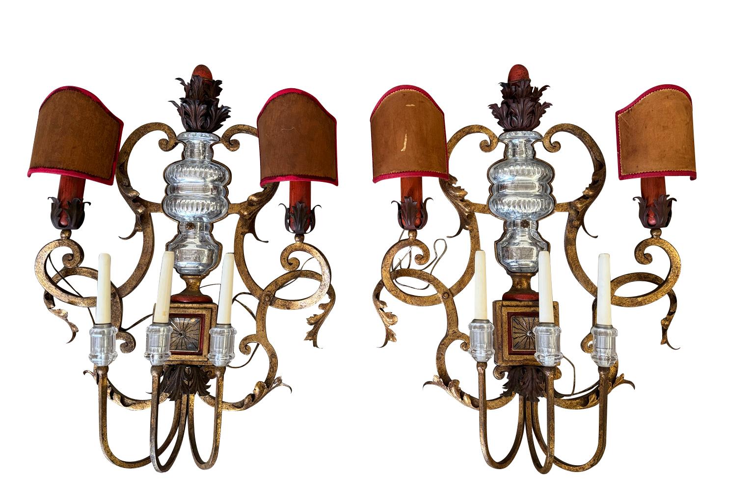 A stunning pair of Maison Bagues Appliques - Sconces from Paris, France.  Beautifully crafted in gilded metal and cut glass.  A very elegant accent for a very elegant surrounding.