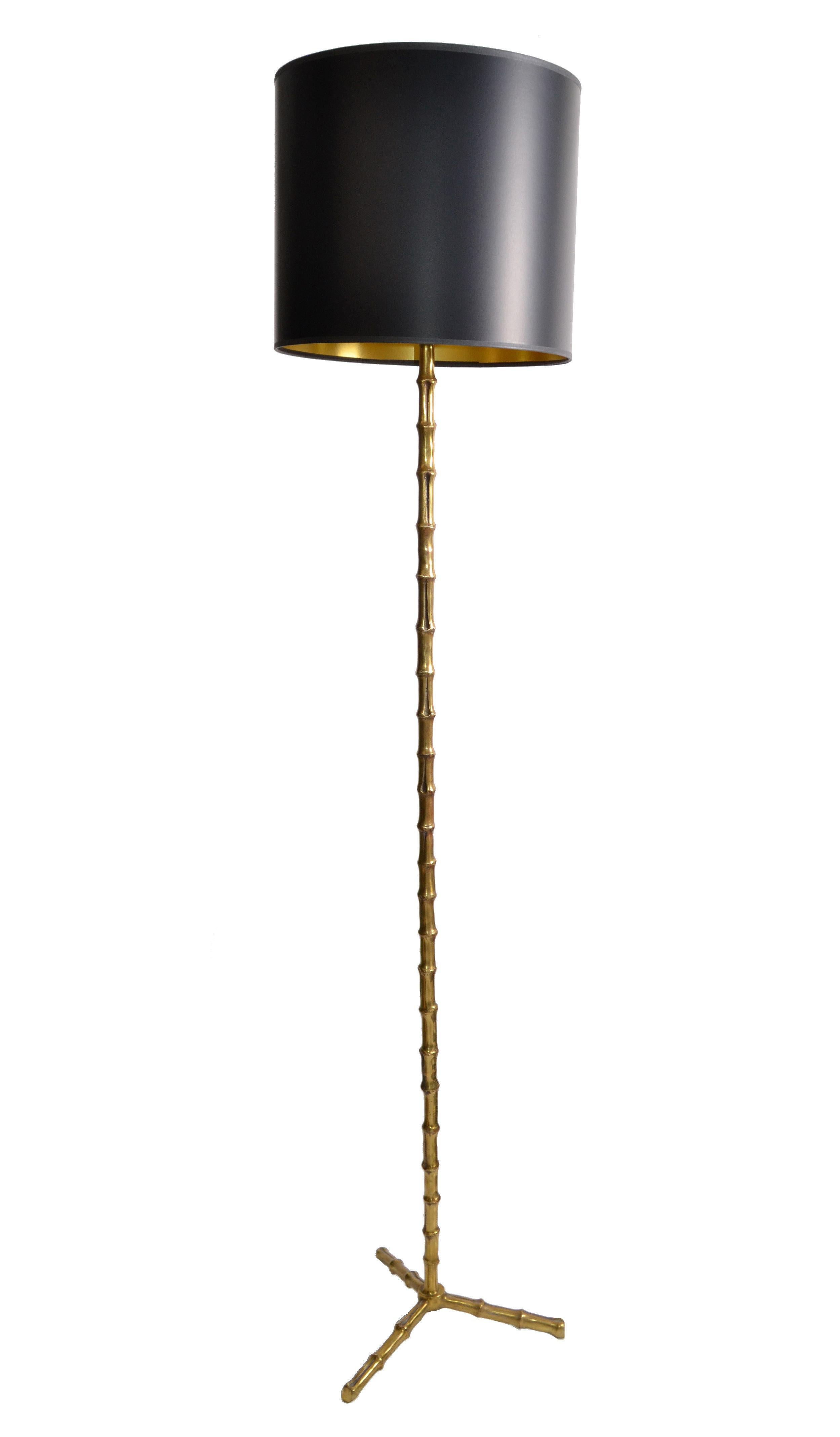 Original pair of Maison Baguès Classic and elegant Faux Bamboo style floor lamp with black & gold paper shade.
2 pairs available 
French Mid-Century Modern made in the late 1950s.
European wiring with foot-switch and cold fabric cord.
Takes a