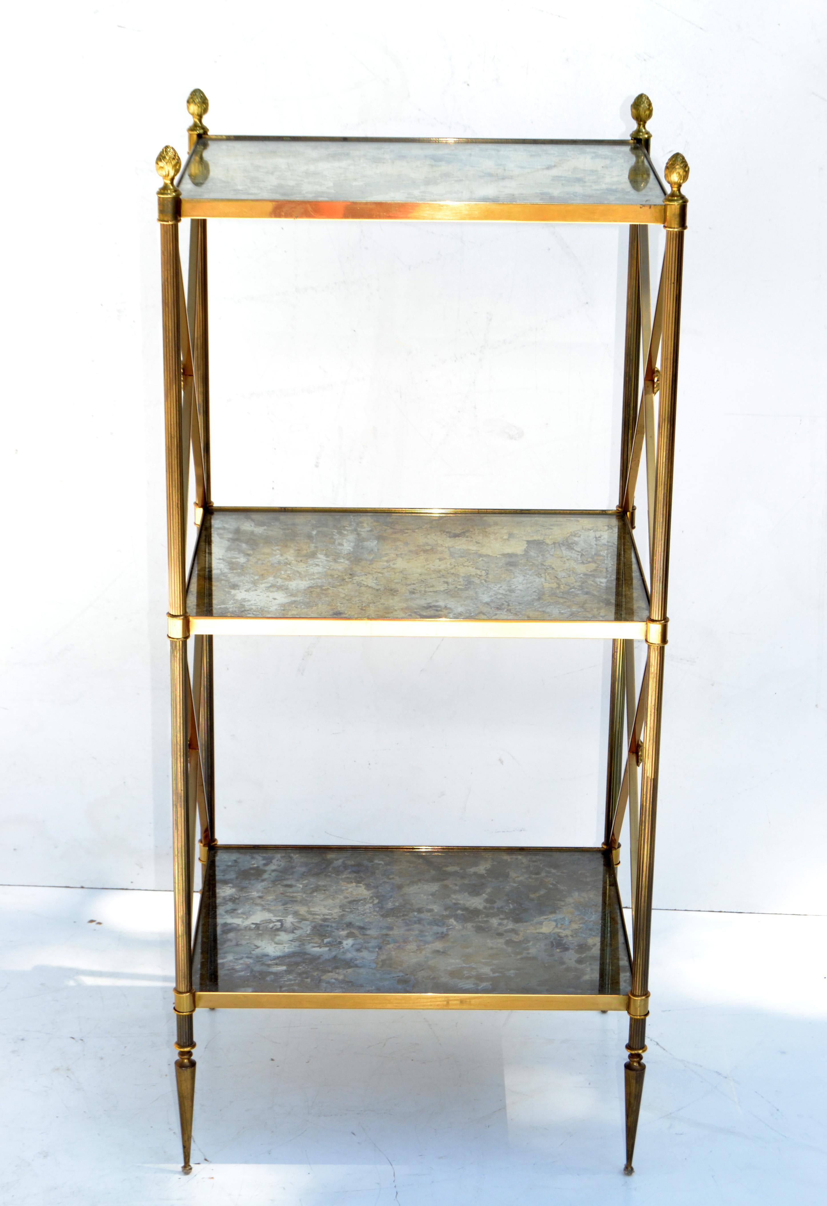 Superb Pair of Maison Baguès 3-tier side table in patinated brass with original mirrored cloudy glass.
Neoclassical French Design from the late 1950.
Very good vintage condition.
 
