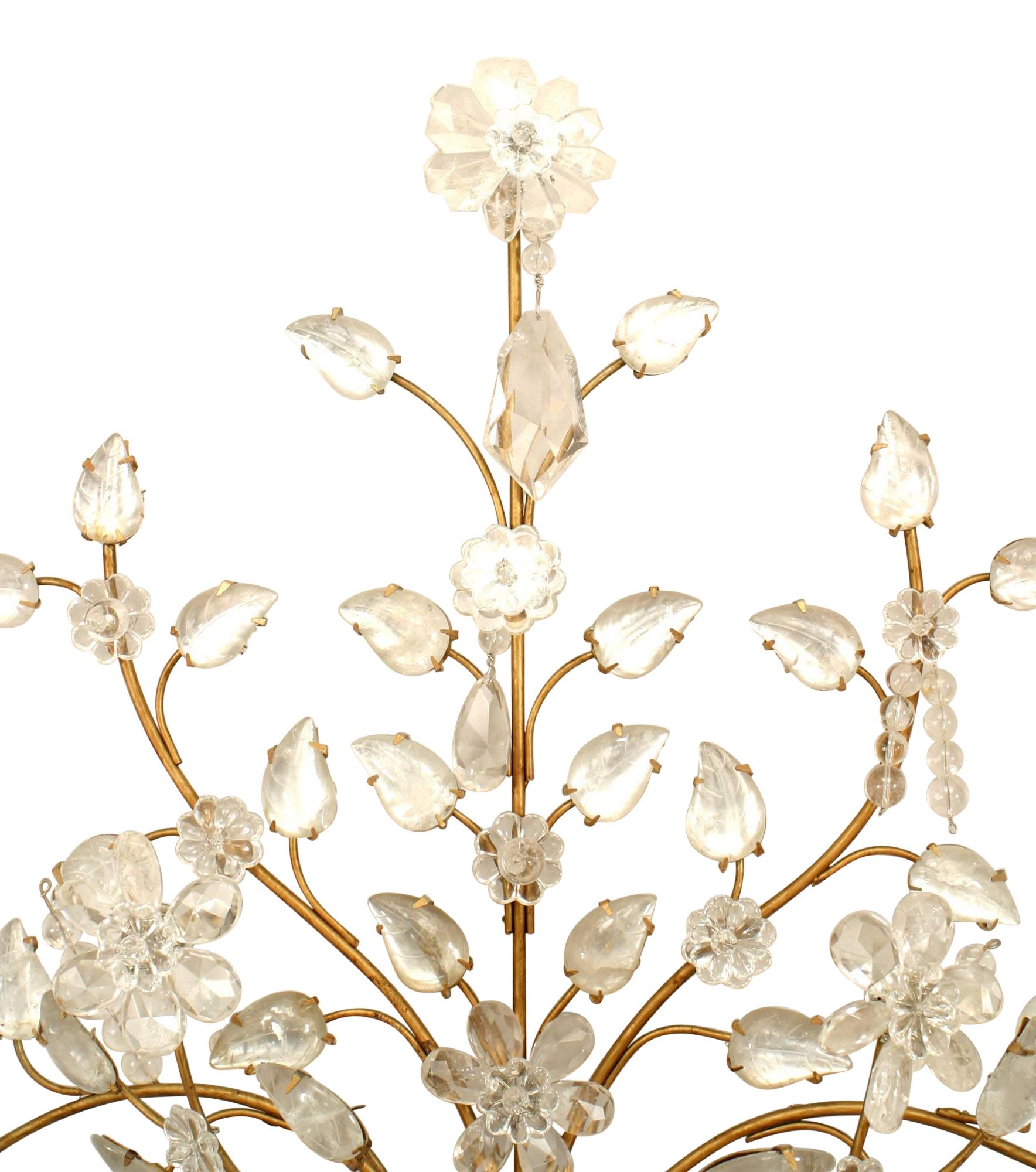 Pair of French Art Deco gilt metal and rock crystal wall sconces with four arms and a spray of flowers emanating from an urn base with a carved and shaped design. (by MAISON BAGUES) (PRICED AS Pair)

These are not wired.
