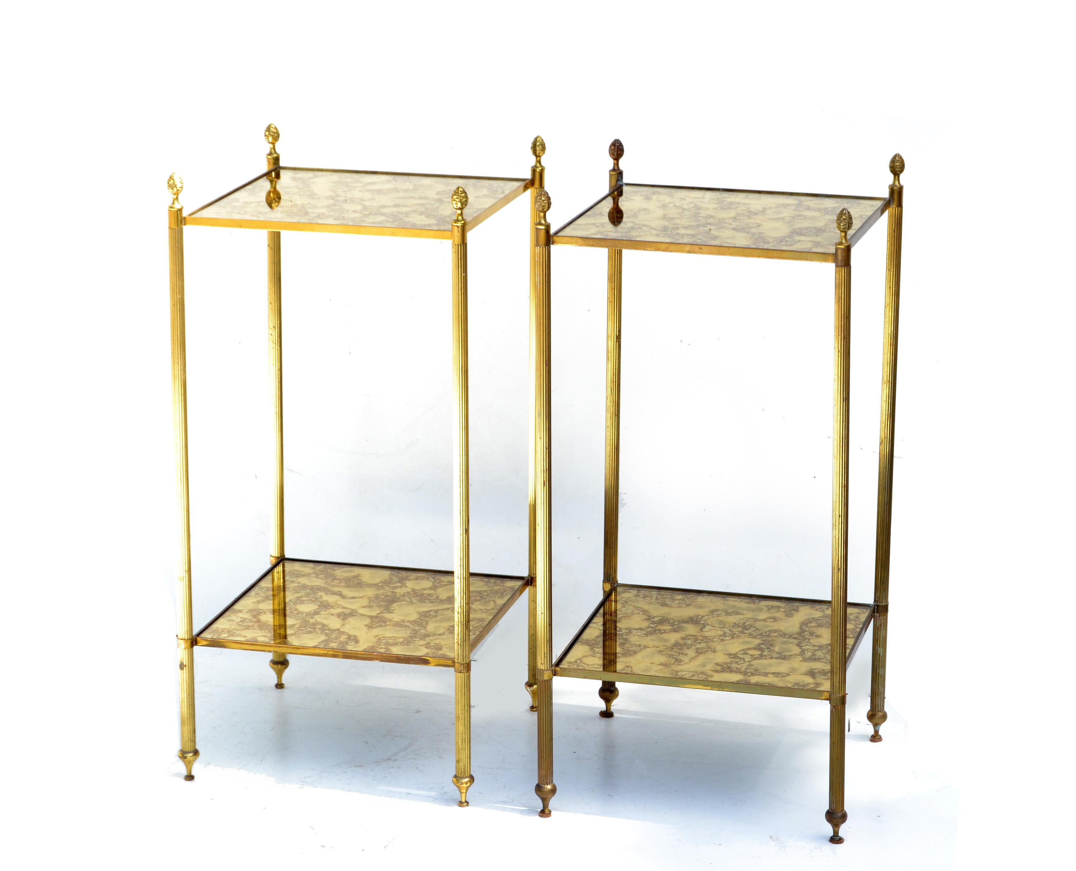 Pair of Maison Baguès French neoclassical side tables.
2-tier brass, bronze and gold cloudy mirrored glass tops.
Mirrored Glass measures: 11.5 x 11.5 inches.