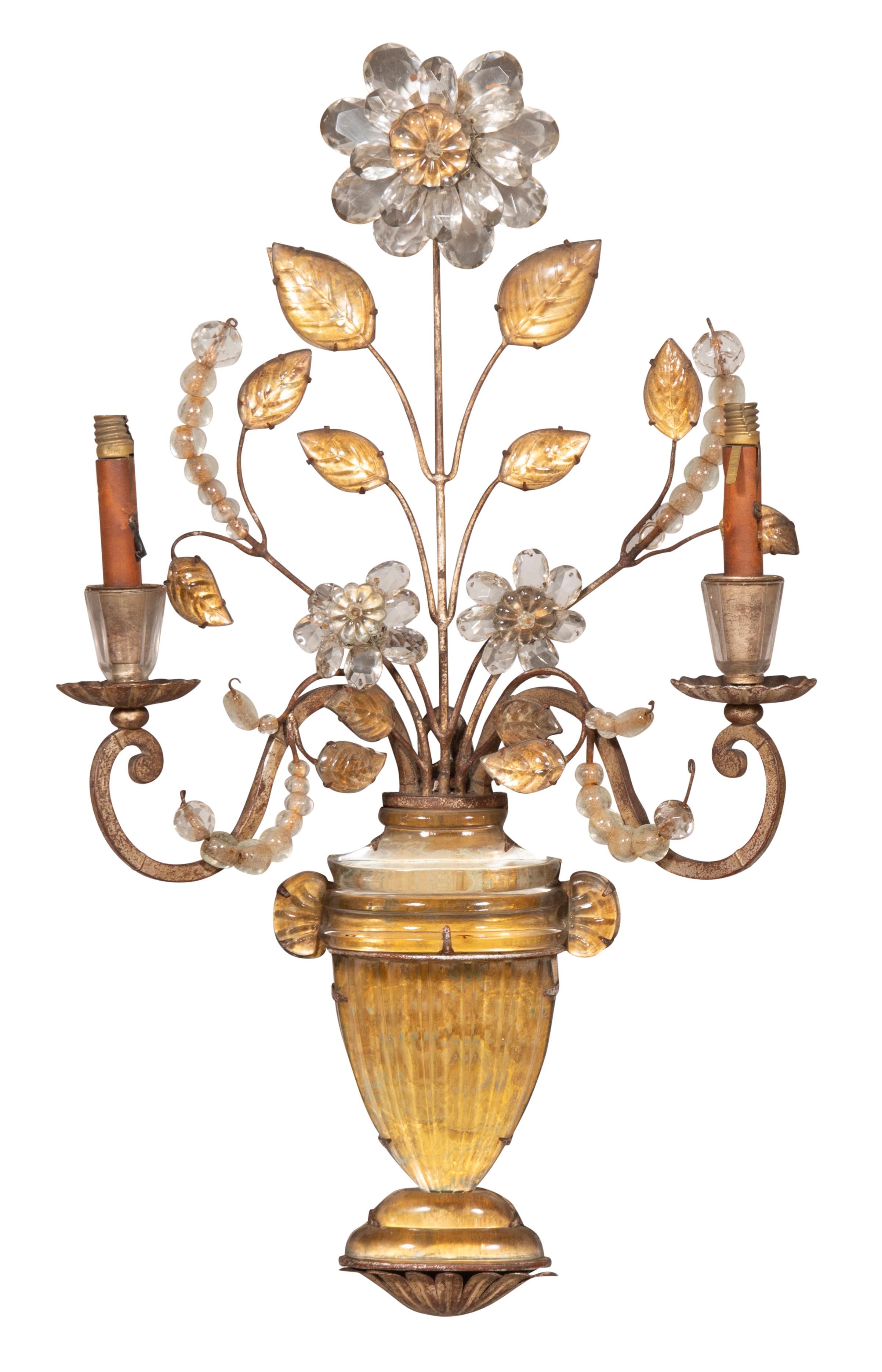 Beautiful elegant sconces with gold and clear glass tones. Two arm with central flower and leaves flowing from classical urns. Currently need wiring.