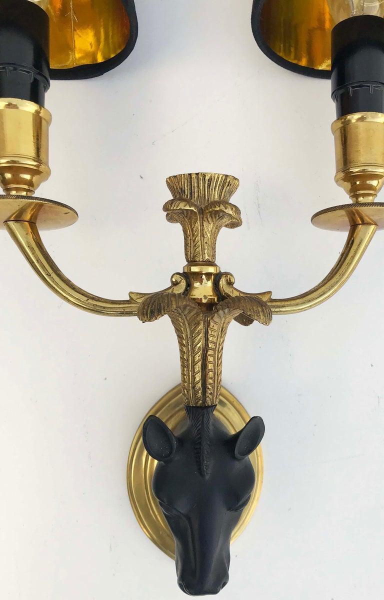 Superb pair of Maison Baguès Horse sconces, Wall lights in 2 patina bronze.
2 lights, 40 watts max bulb per light 
US Rewired and in working condition 
Custom back-plate available.
Measures: Back-plate: 4 H x 3 W inches.