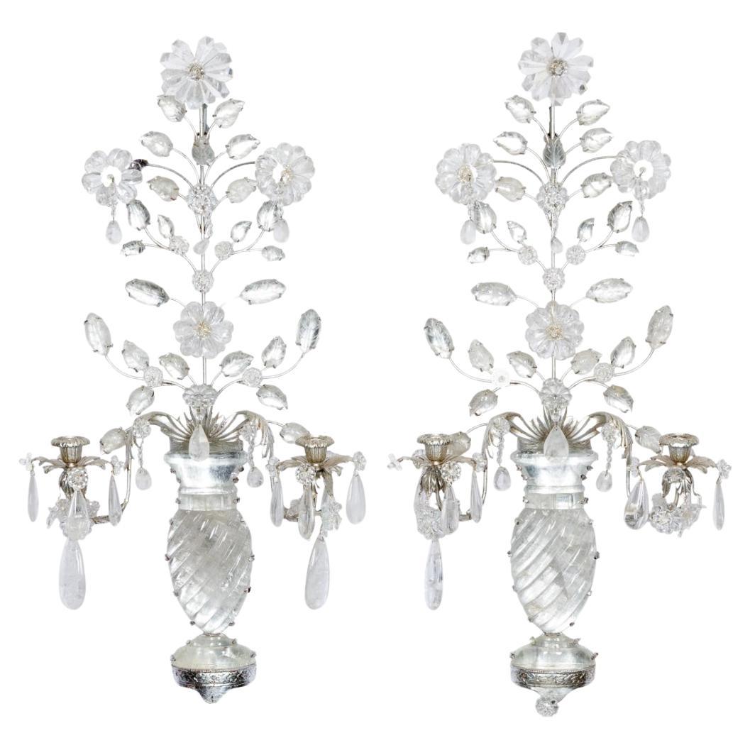 Gorgeous pair of Maison Bagues style  silver metal and rock crystal two light wall sconces. This pair features a rock crystal vase or urn and overflowing flowers with rock crystal drops. Creates an amazing upscale decorator look. So pretty!