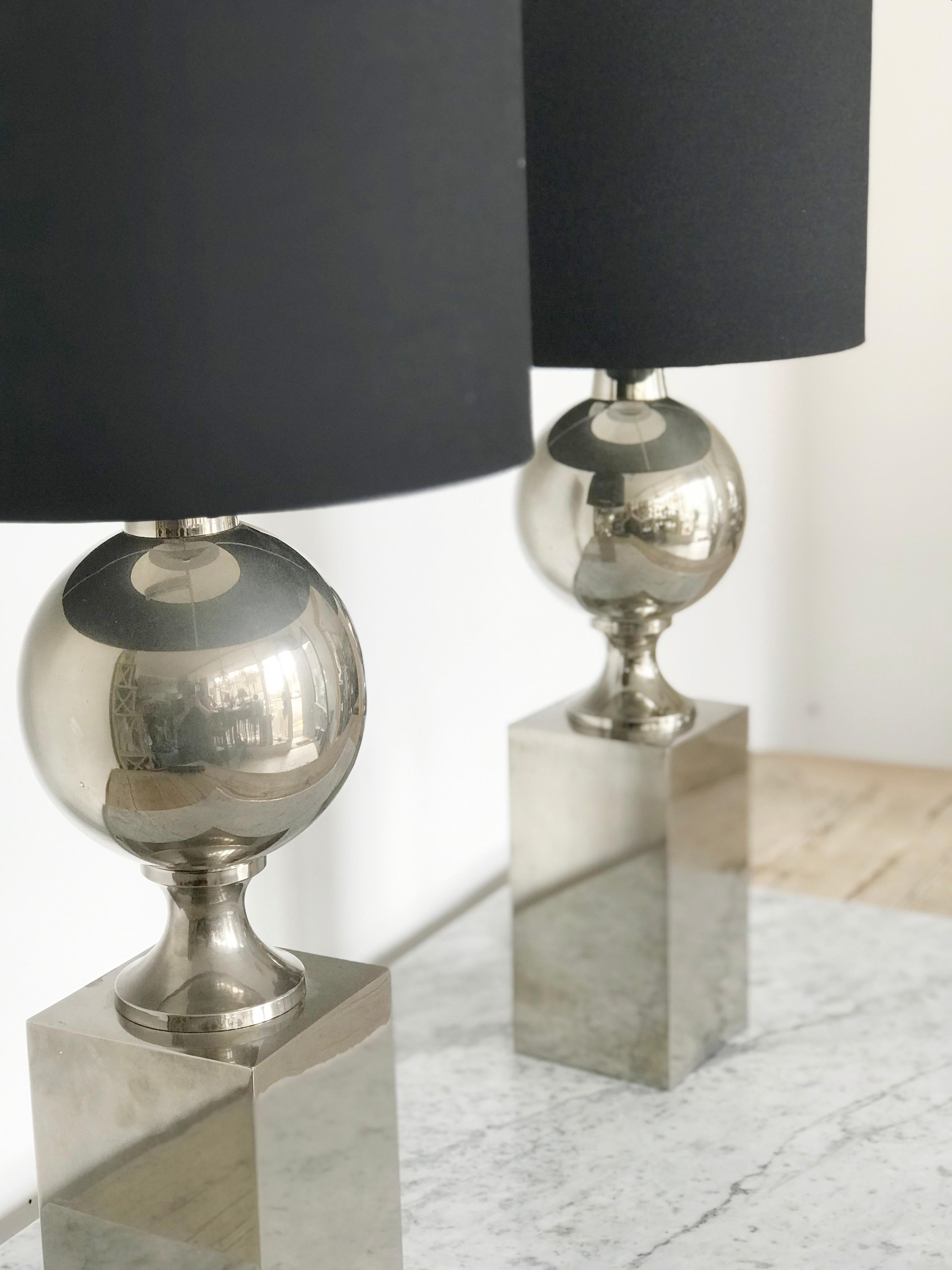 Pair of Philippe Barbier for Maison Barbier chromed steel table lamps of globular form, this Classic and chic style so typical of the Maison Barbier style.
France, 1970s
Contemporary black shades.

There are some small dings in the body, as