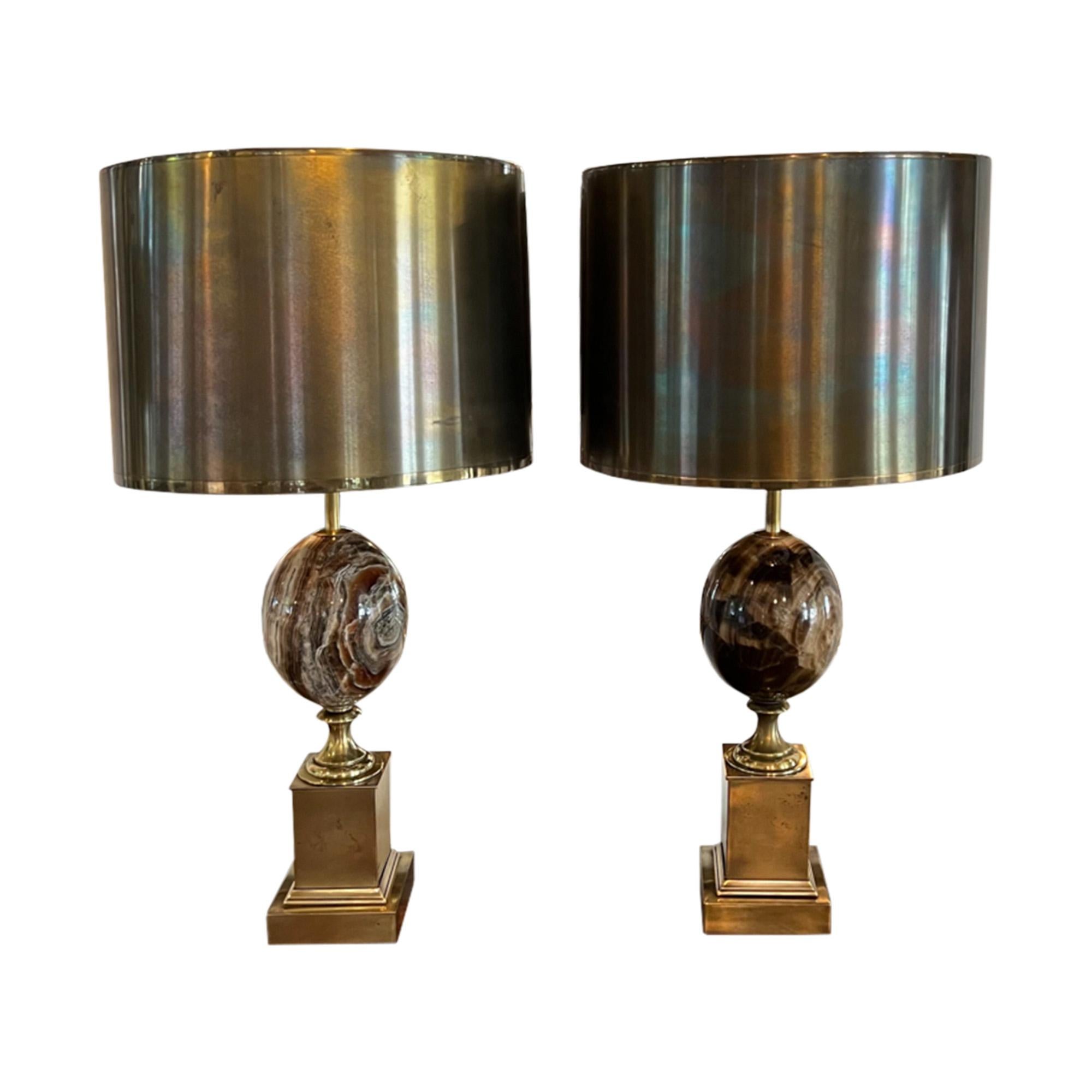An iconic design by the French lighting designer Maison Charles, this near pair of lamps are stamped with the maker's name (see picture). Amazing quality, handcrafted in France and retaining their original metal shades. 

Please see the pictures