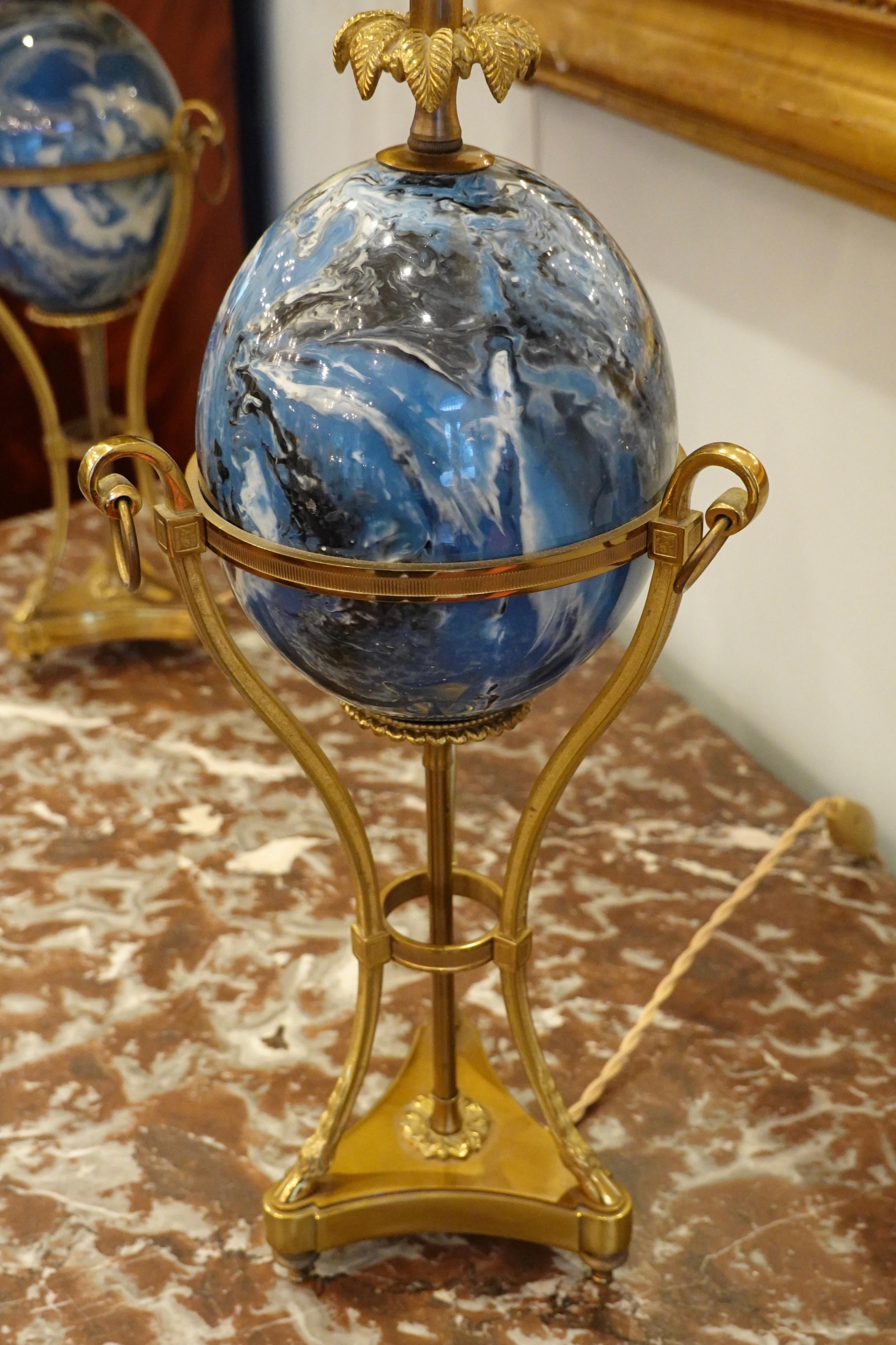 Brass Pair of Maison Charles Neoclassical Tripod Form Lamps with Blue Ostrich Egg