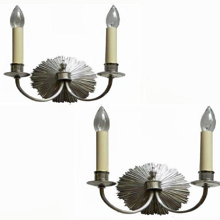 Superb pair of Maison Charles model petit soleil in nickel-plated finish Signed CHARLES Made in France, numbered 131 US rewired and in working condition. Two bulbs 60 watts max each. Back plate: 6 inches diameter.
Exist also in bronze.
Have a look
