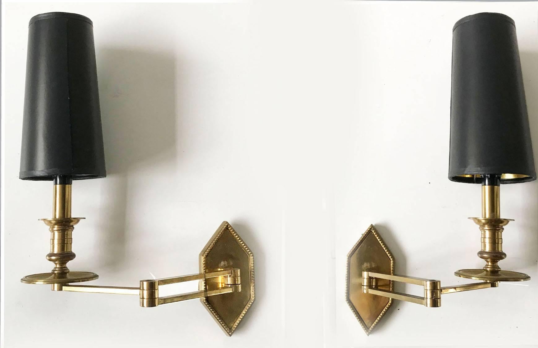 Pair of Maison Charles Swing Arm Sconces