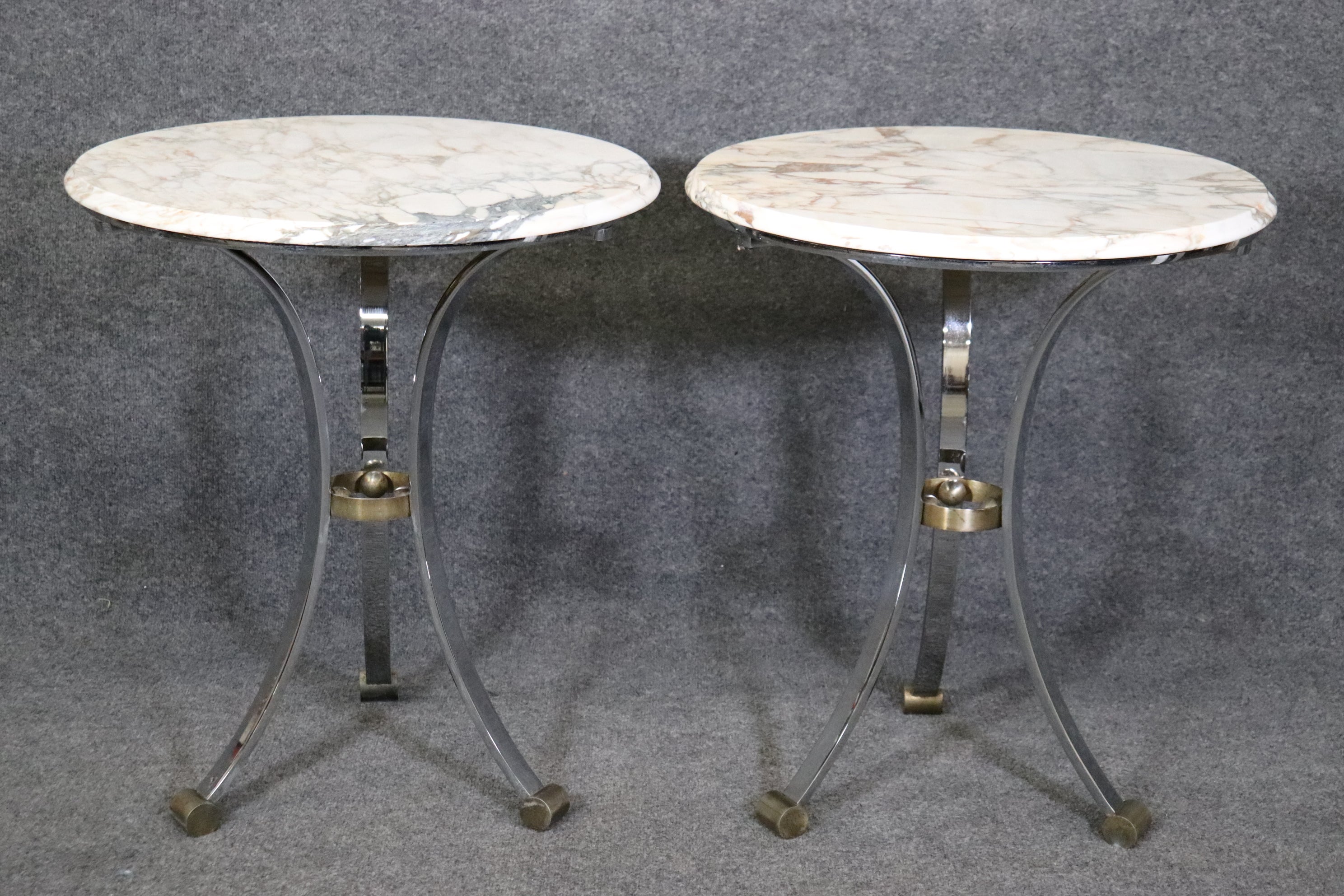 Dimensions- H: 27 1/2in W: 23 3/4in D: 23 3/4in 
This Pair of Maison Jansen Attributed Marble Top Gueridon Tables, End Tables have a minimalistic design but pack a big punch! This pair of Gueridons are made of the highest quality and are perfect
