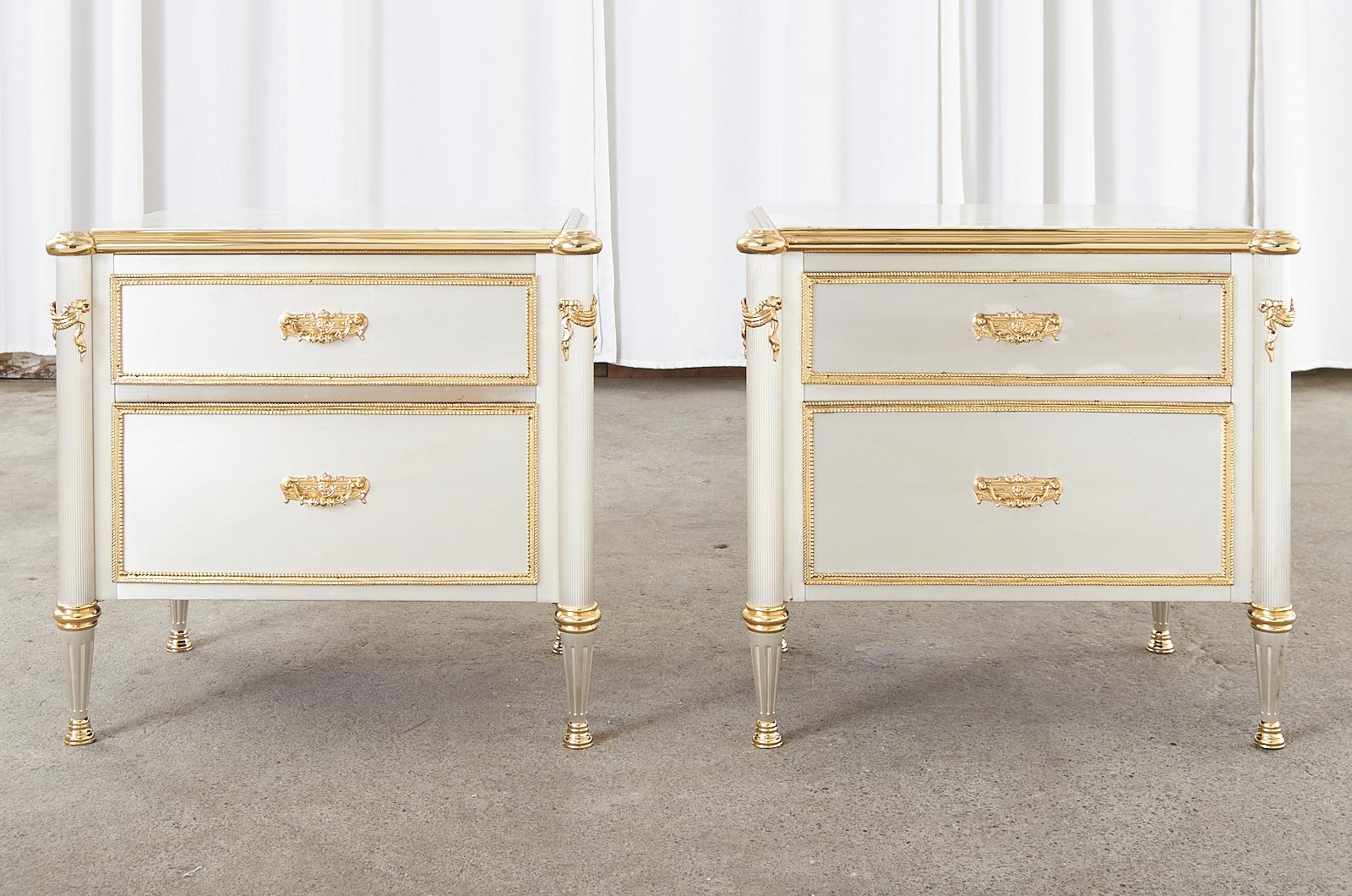 Magnificent pair of steel mahogany commodes, nightstands, or chests of drawers attributed to Maison Jansen, France. The chests feature a thick carrara marble top with a polished brass stepped border. The cases are crafted from rich radiant grained