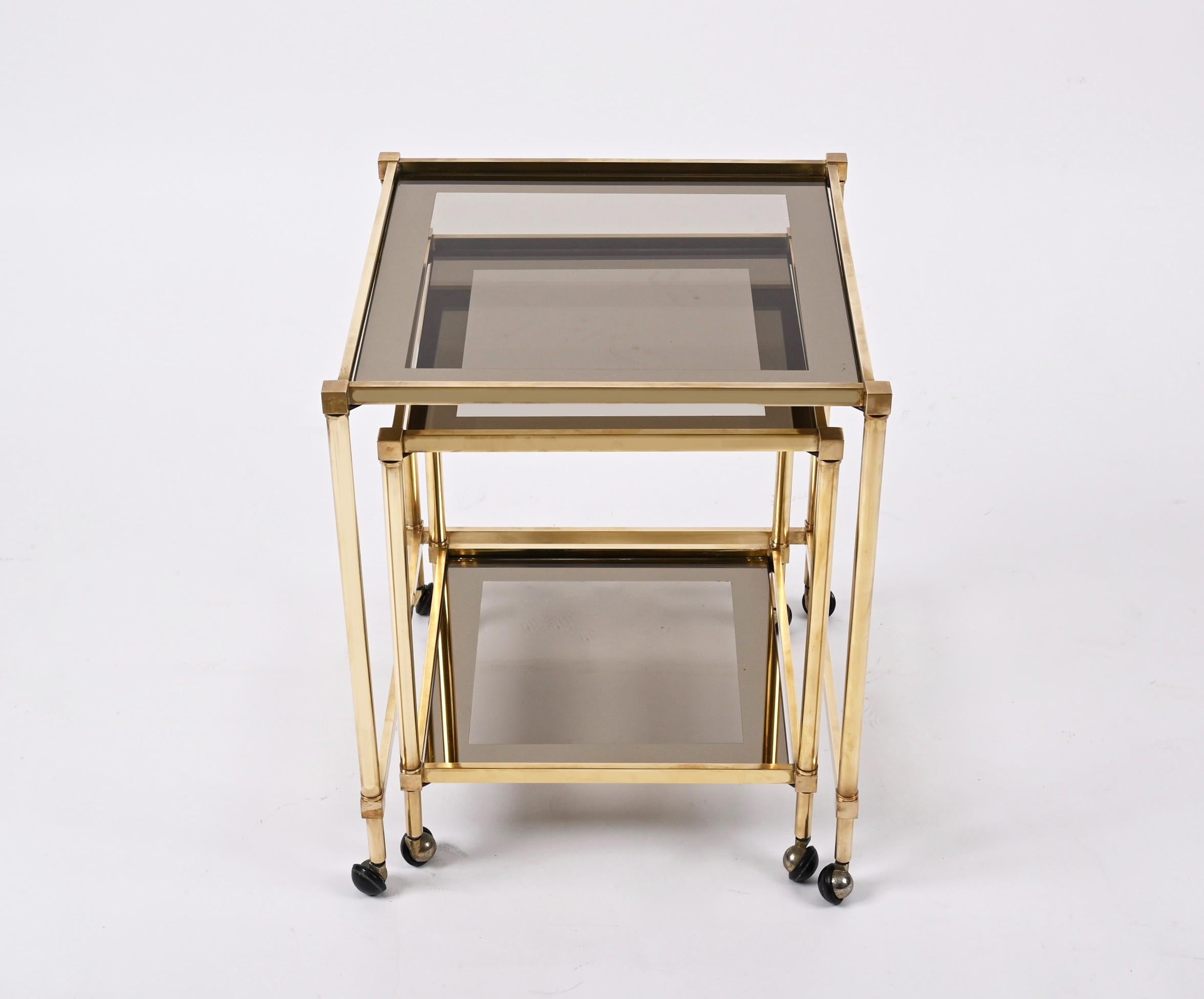French Pair of Maison Jansen Brass Mirrored Border Nesting Tables with Glass Top, 1970s For Sale