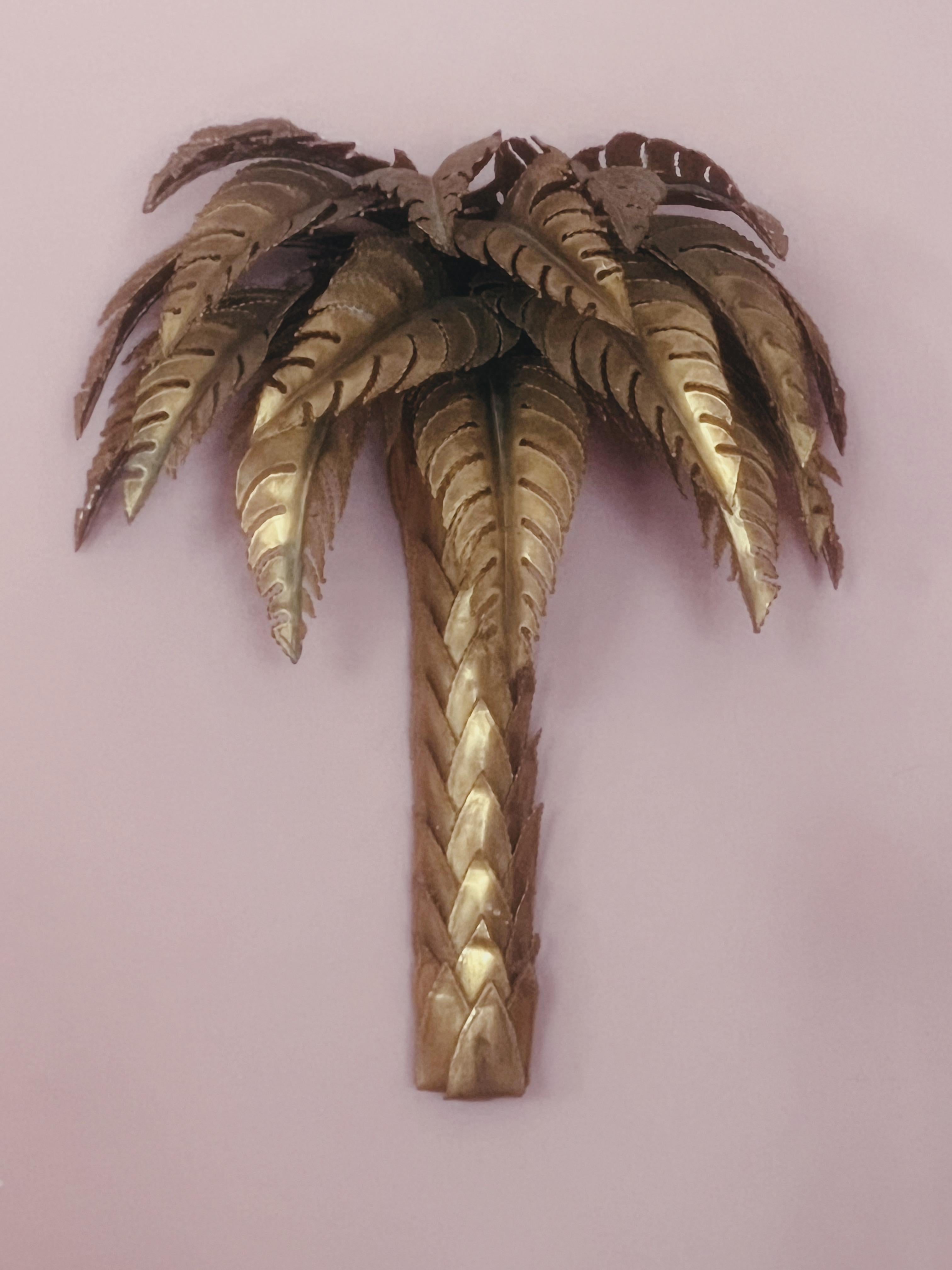 Wonderful rare pair of Maison Jansen, palm wall lights, large brass leaves which hide two bulbs, these came from a hotel in the south of France, they are untouched since their instillation in 1973, therefore the condition is perfect. These are the
