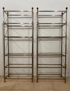 Pair of Maison Jansen Paris, brushed steel and brass six shelf etageres