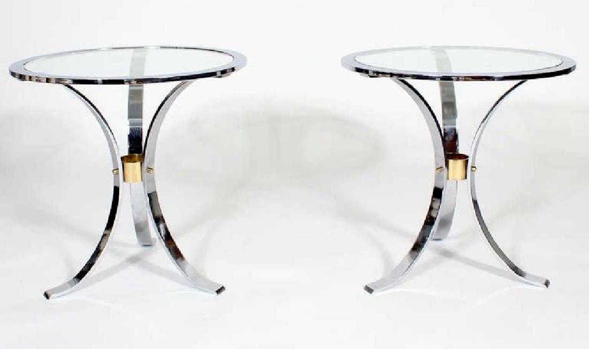 Pair of Maison Jansen polished steel and brass side tables, each one of circular form with inset glass tops