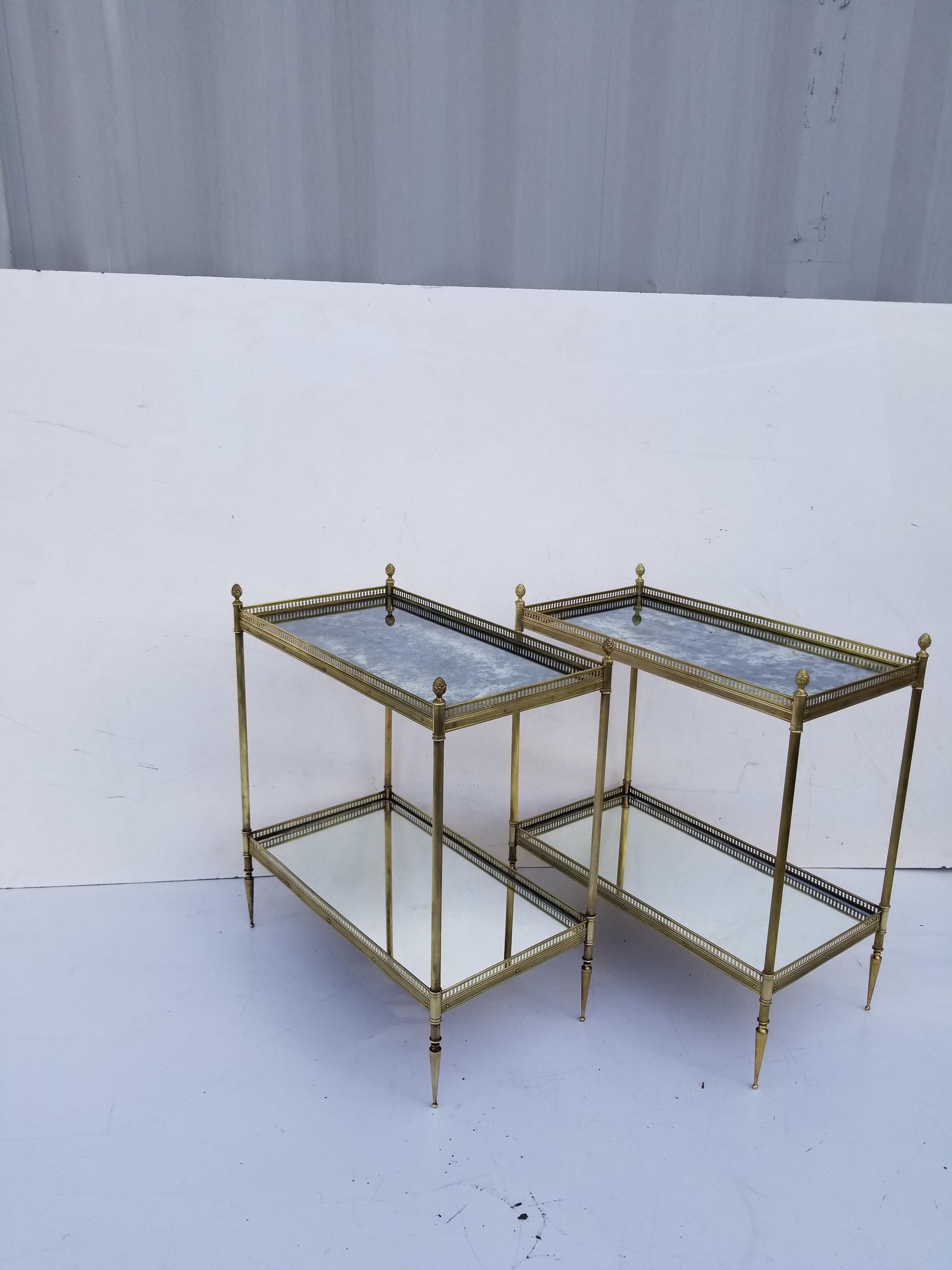 Pair of Maison Jansen side table, mirror tops. Brass gallery, bronze finials.
Very good vintage condition.
8 