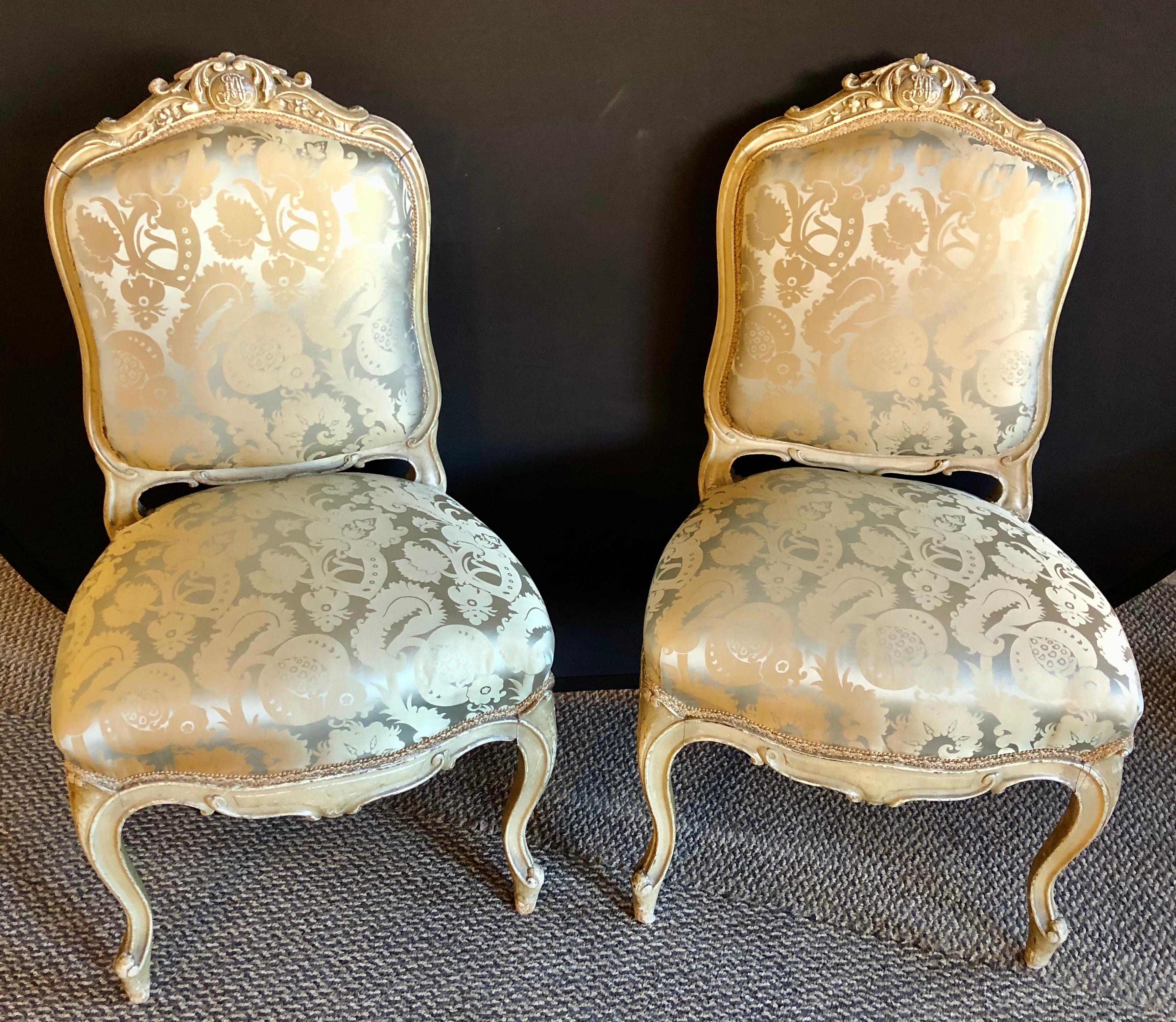 Pair of Maison Jansen slipper chairs in Scalamandre upholstery in fine frames. This is simply the finest pair of painted carved French frames one can wish to own. The silk Scalamandre upholstery is very clean with a lace welting. The frames