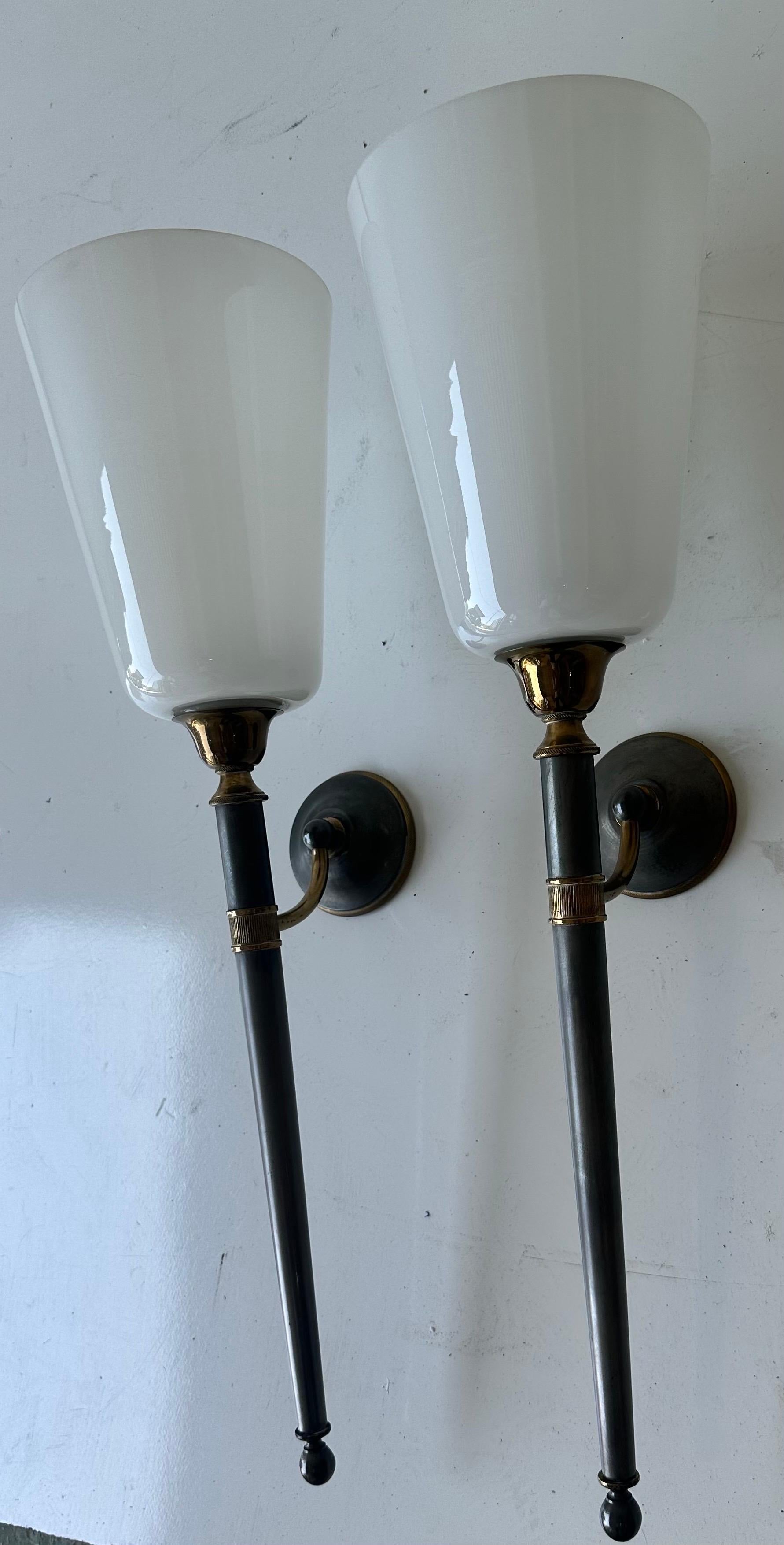 Pair of Maison Jansen Style 2 patina brass and gun metal Wall Sonces.
 Original White opaline glass shades 
Backplate is 3.5 diameter.