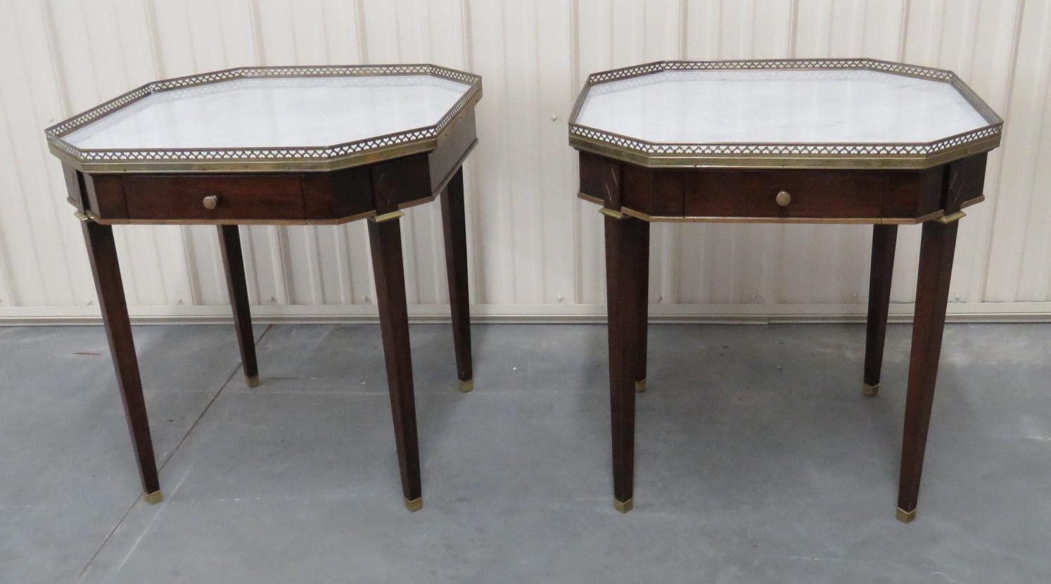 Pair of Maison Jansen style marble top 1 drawer bouillotte tables with a brass gallery.