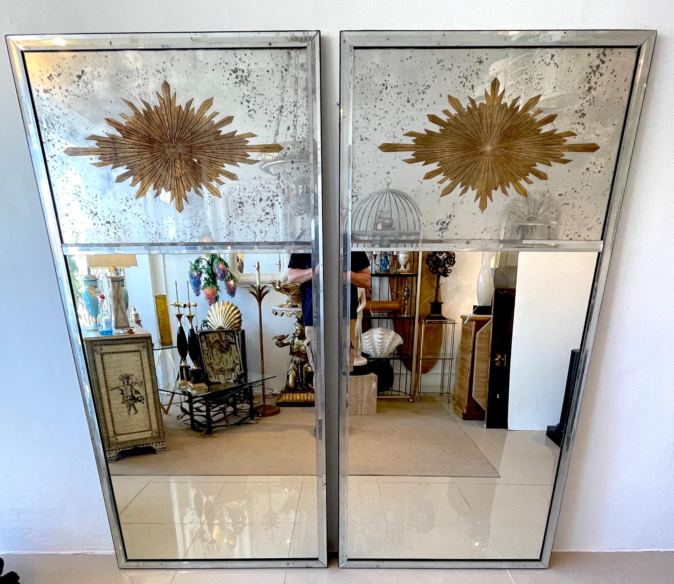 Pair of Maison Jansen style Eglomise Sunburst Medallion Trumeau mirrors
We are pleased to offer a stunning pair of Tall Neoclassical Mirrors. Each one with upper section with an elongated eglomise gilt sunburst, (21.5-Inches high x 34.5 inches